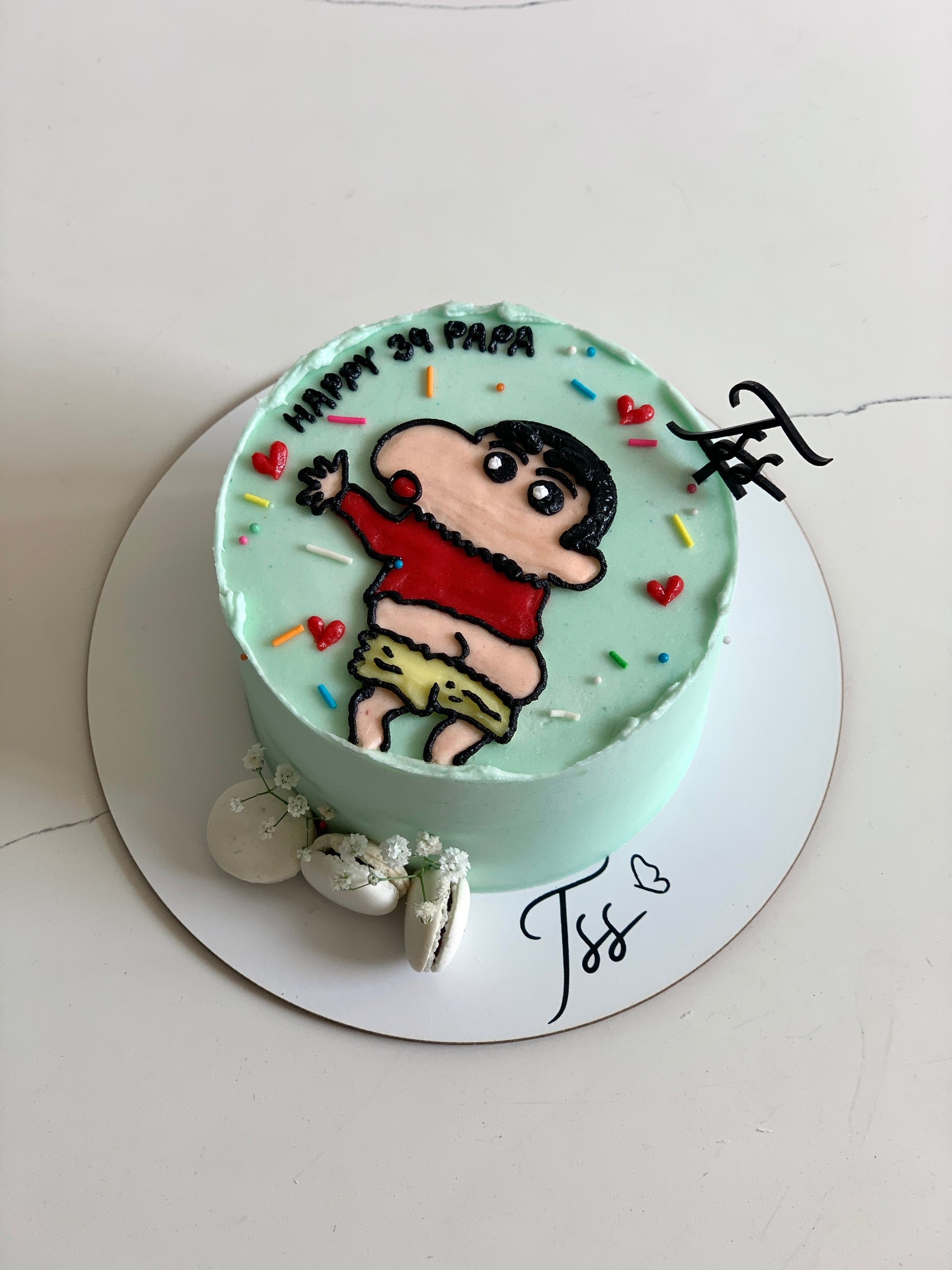 Decorative buttercream illustration cake by The Sinful Spoon with colorful floral designs and intricate piping details.