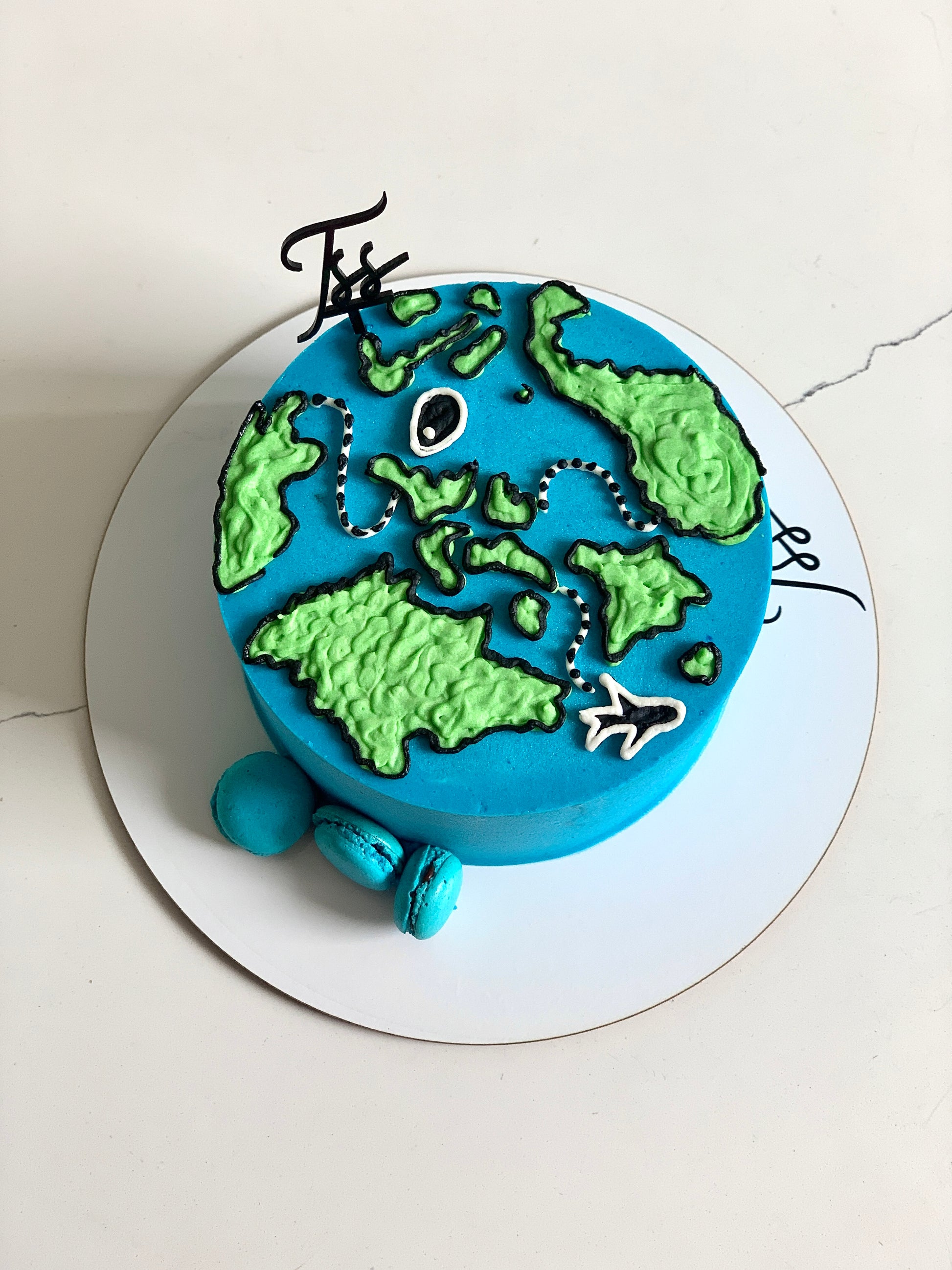 Decorative buttercream illustration cake by The Sinful Spoon featuring colorful floral and abstract piping designs.