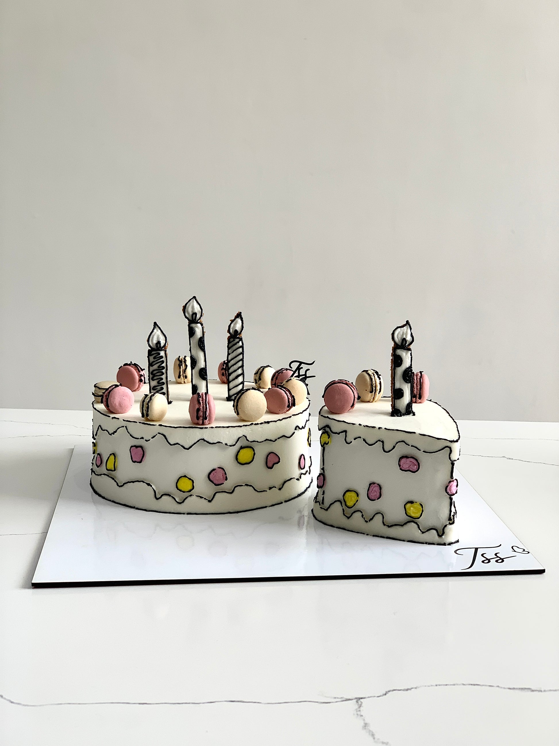 Colorful comic-themed cakes from The Sinful Spoon featuring vibrant frosting and creative superhero designs.
