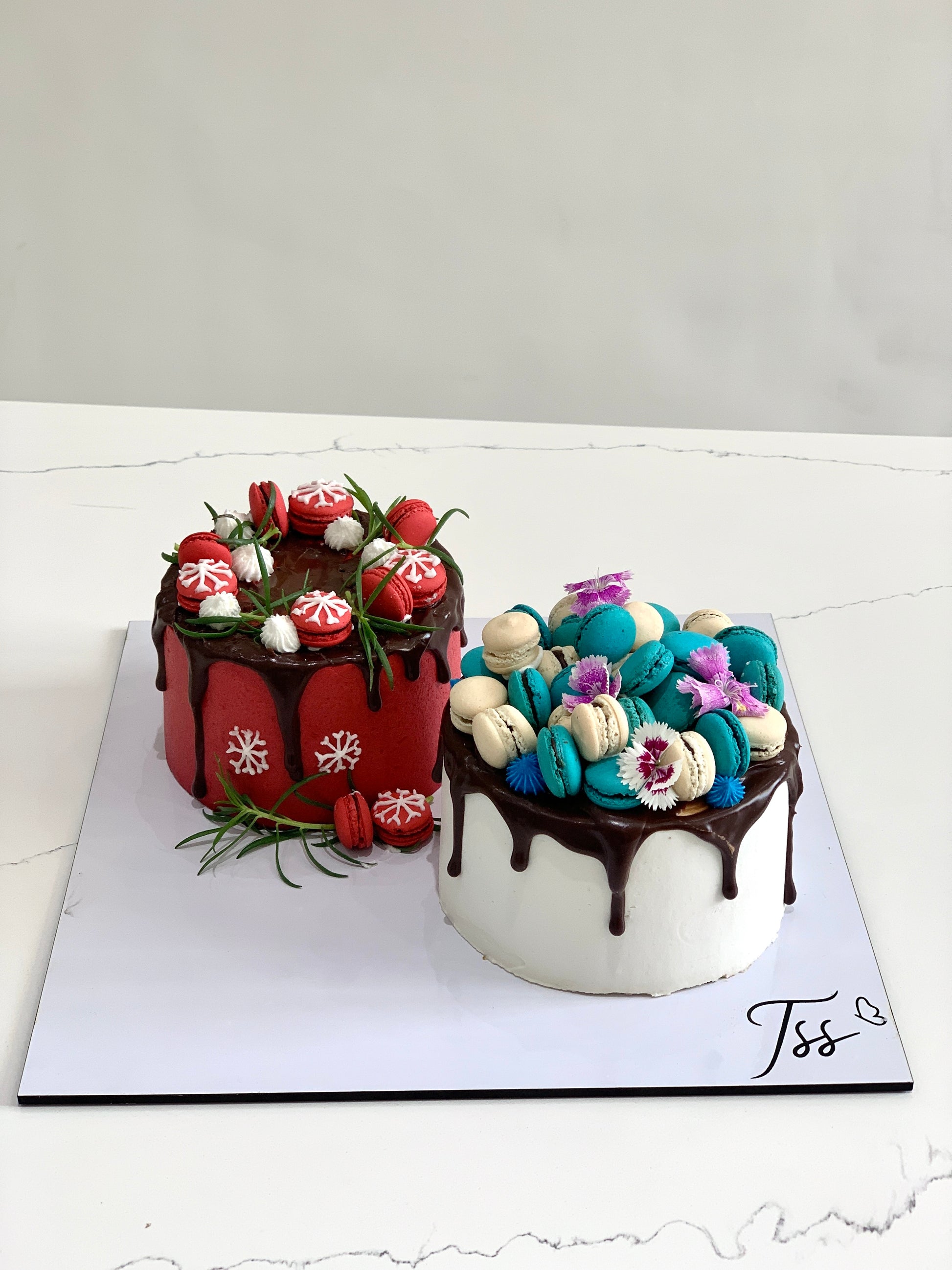 Assorted combo cakes from The Sinful Spoon, featuring a variety of colorful, layered desserts on a decorative plate.