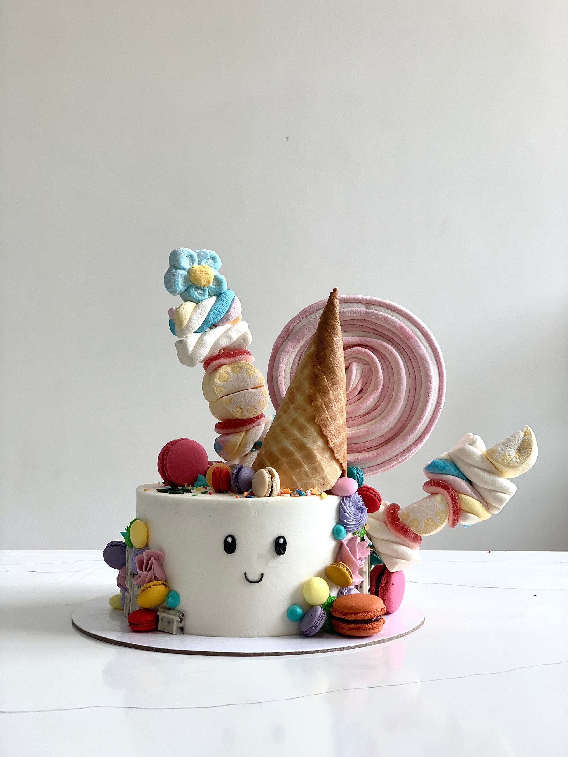 Decorative shape cakes from The Sinful Spoon with colorful, intricate designs, perfect for special occasions and celebrations.