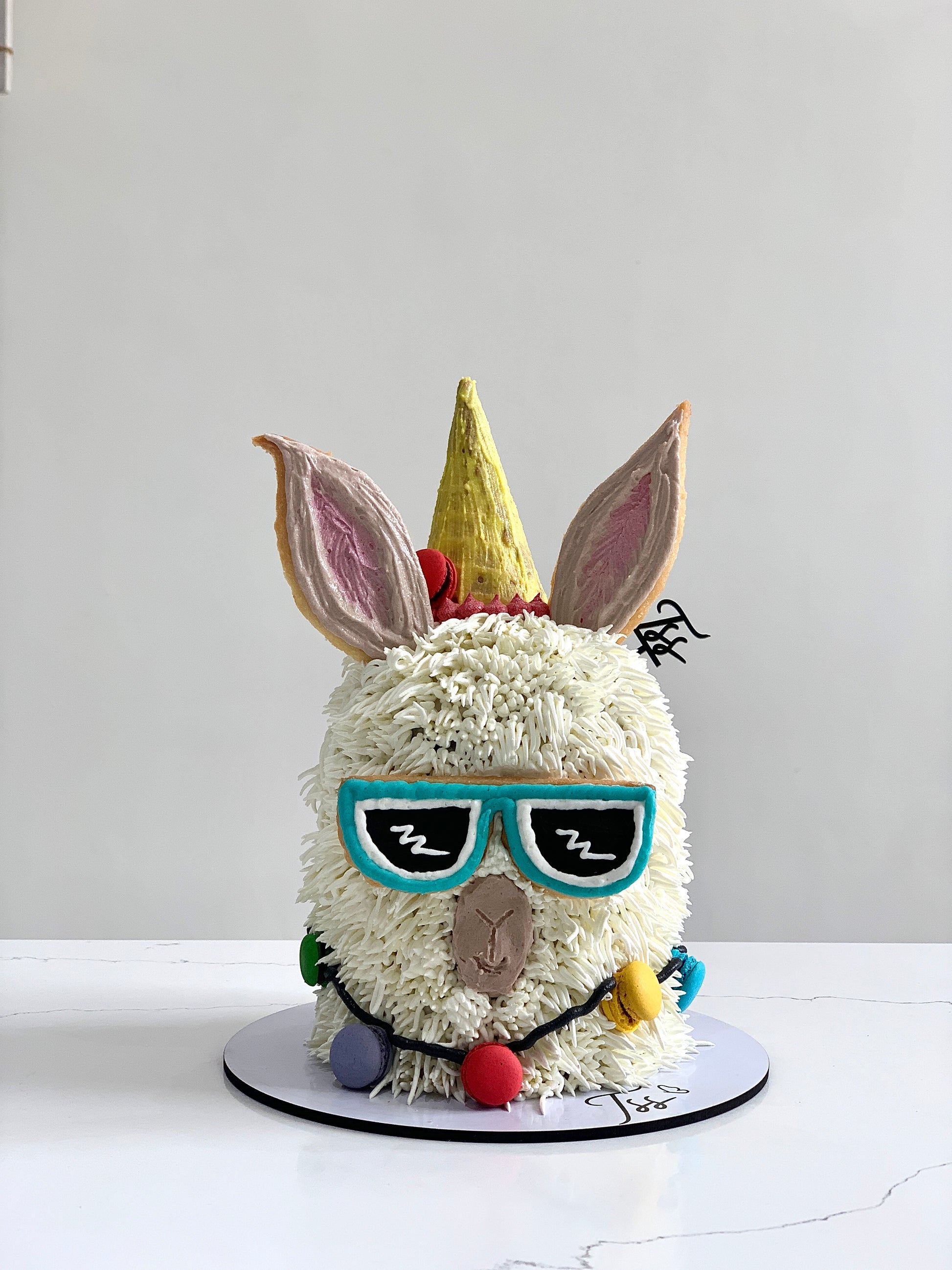 Colorful Shape Cakes from The Sinful Spoon, decorated with vibrant icing and festive designs, perfect for celebrations.