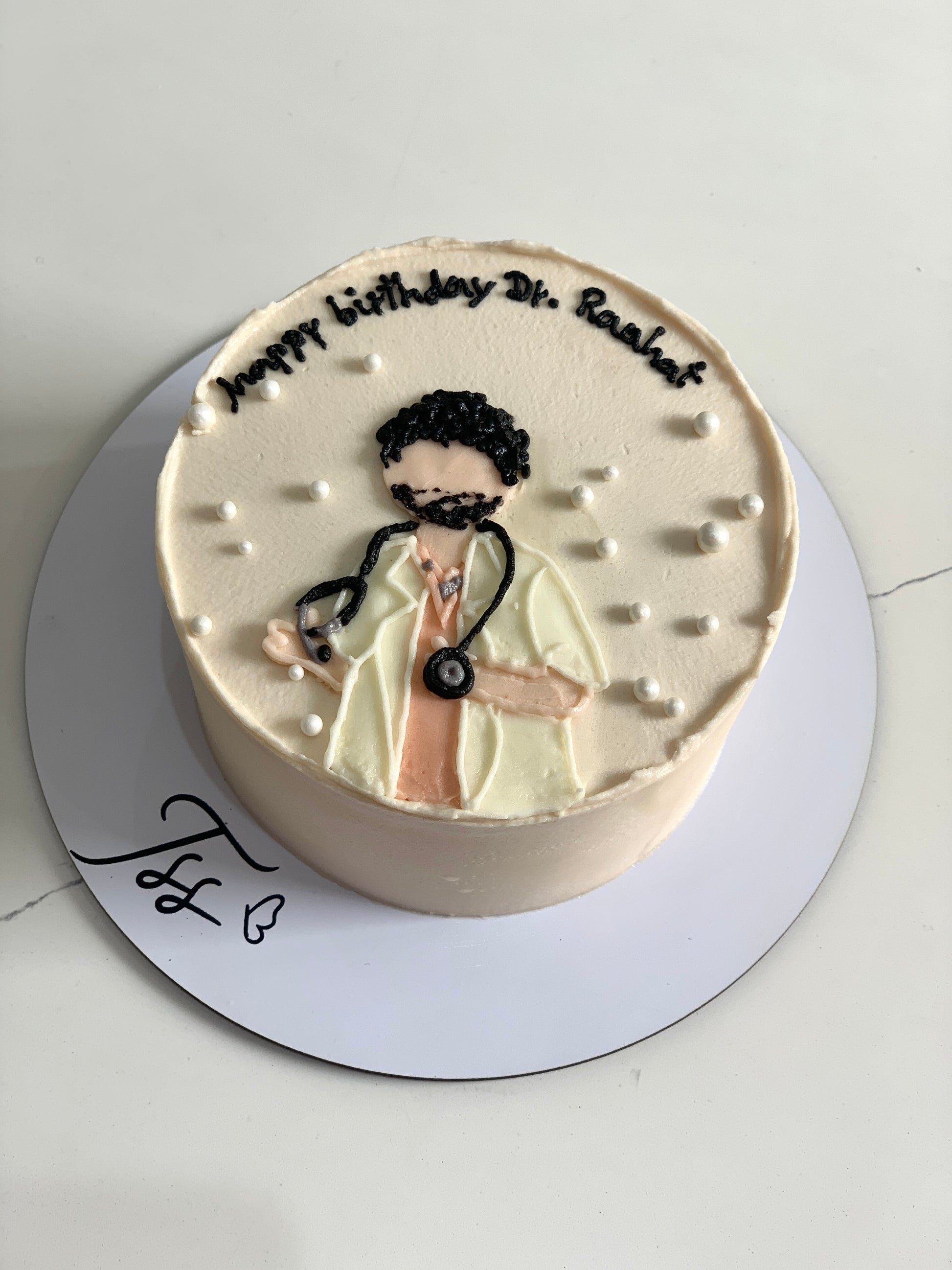 Colorful buttercream illustration cake by The Sinful Spoon with vibrant decorative piping and artistic edible designs.