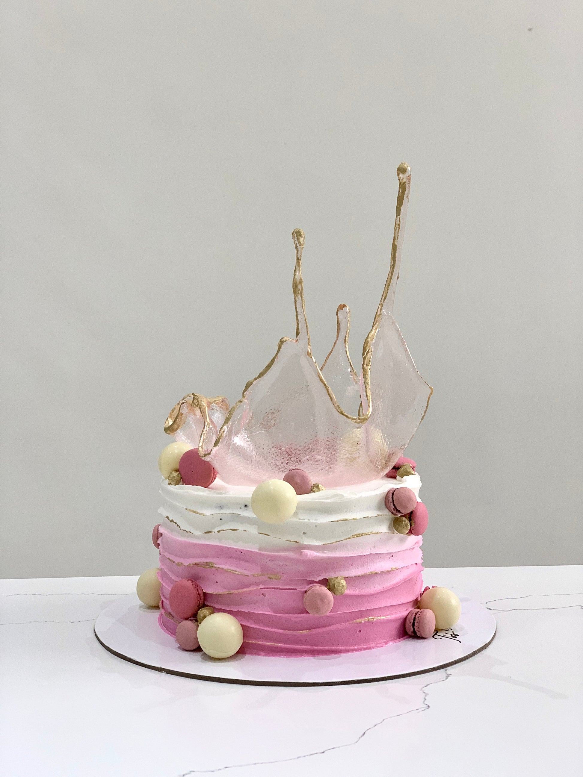 Isomalt cakes from The Sinful Spoon, colorful sugar art pieces used for cake decorating and confectionery craftsmanship.