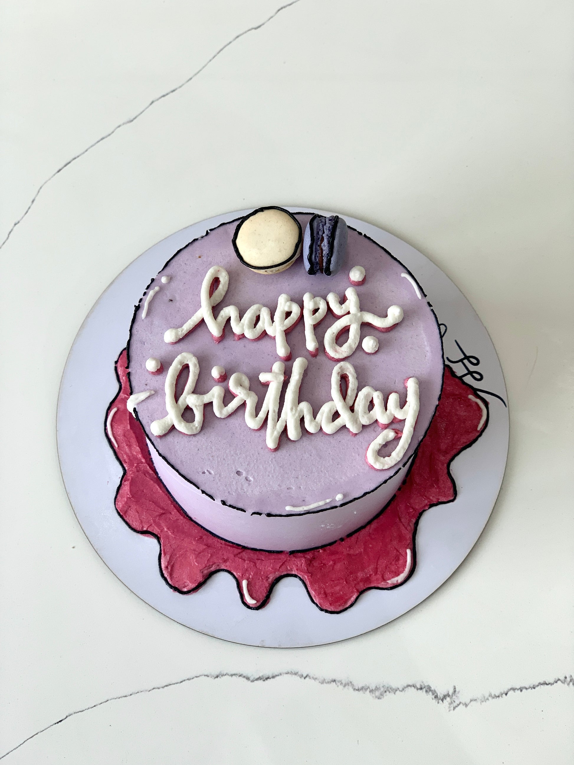 Colorful comic-themed cakes from The Sinful Spoon with vibrant frosting and detailed character decorations.