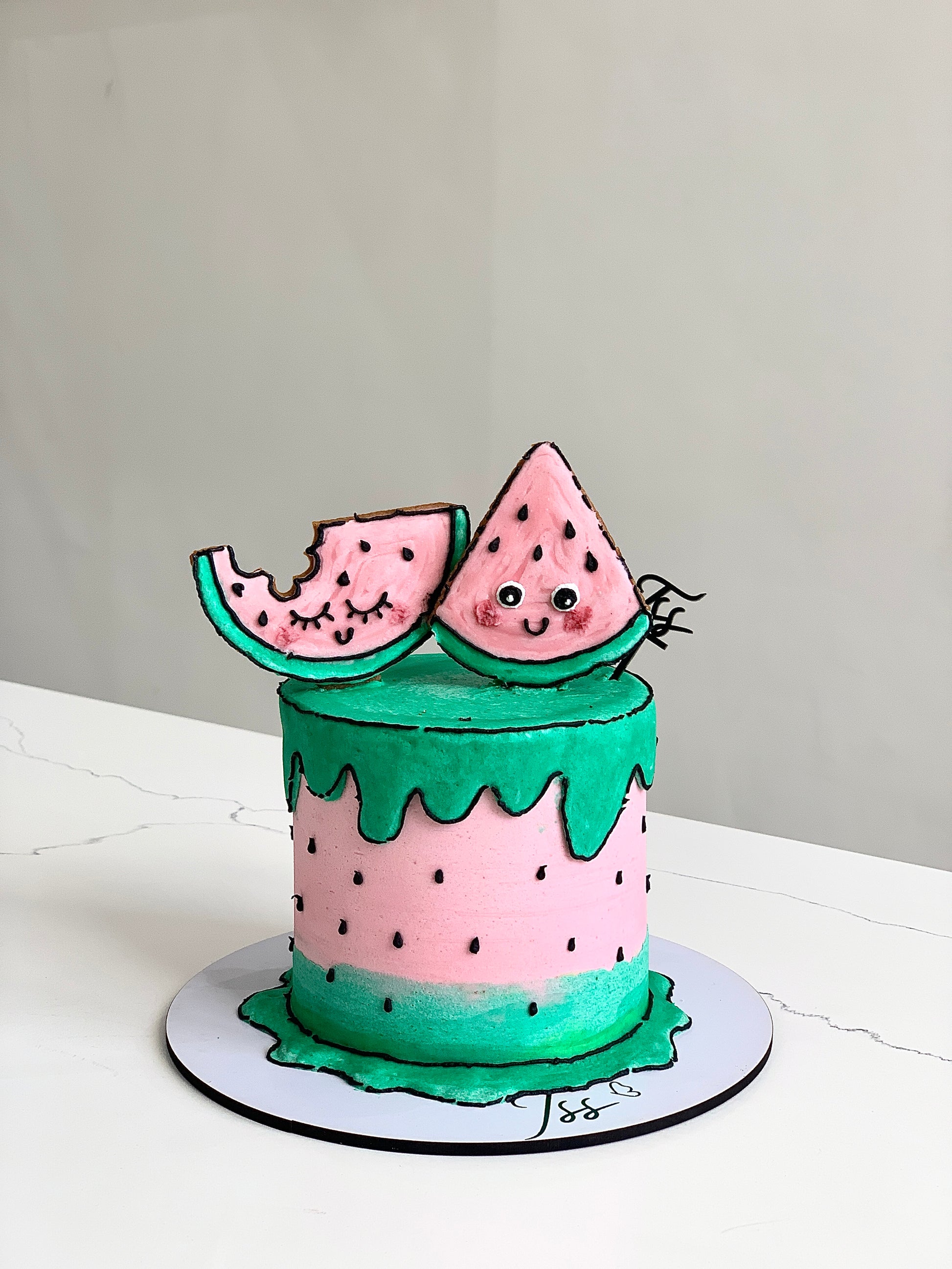 Colorful comic-themed cakes from The Sinful Spoon, decorated with vibrant icing and playful comic book designs.