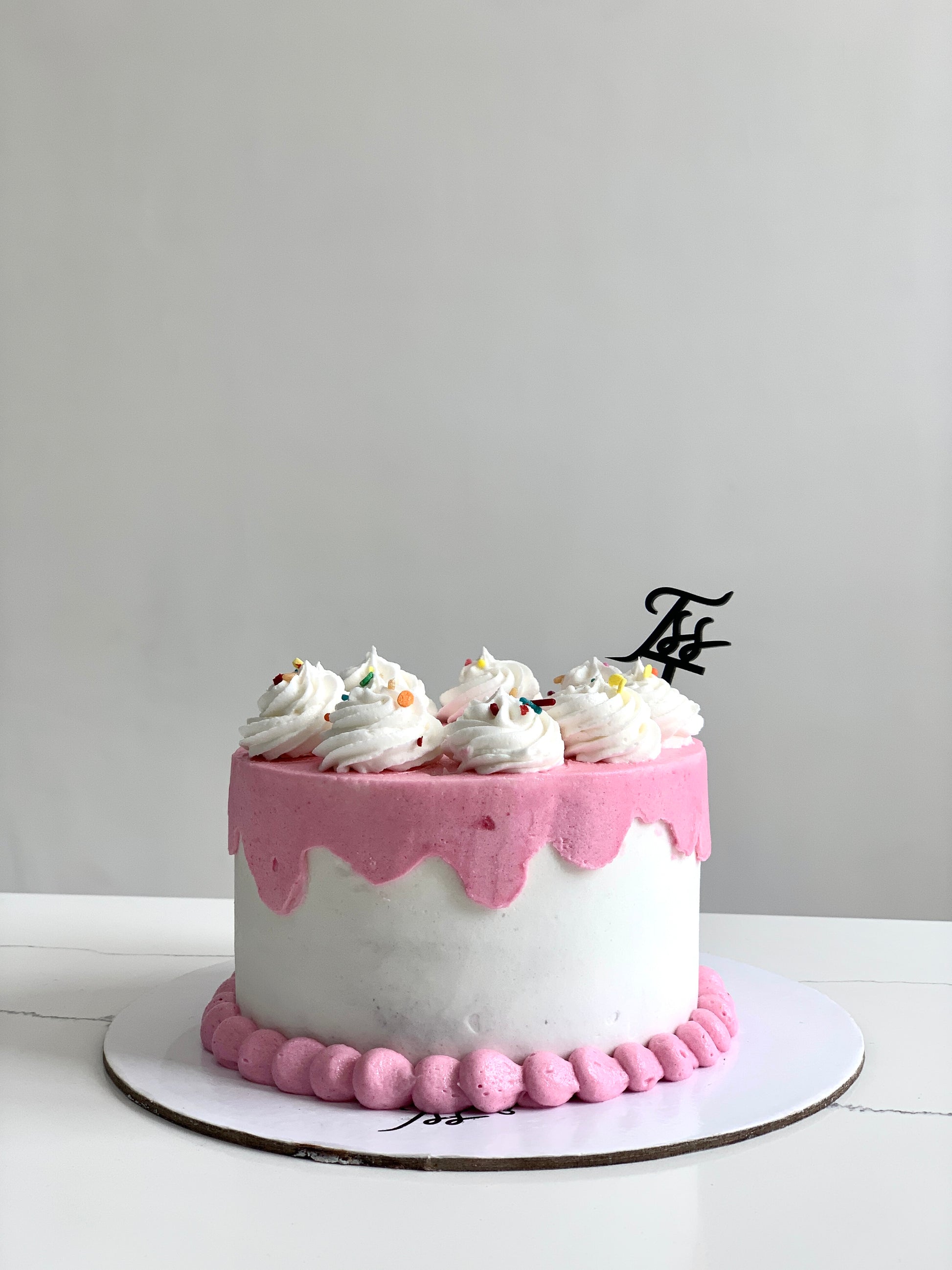 Classic Cakes by The Sinful Spoon featuring a variety of colorful, freshly baked cakes with rich frosting and decorative toppings.