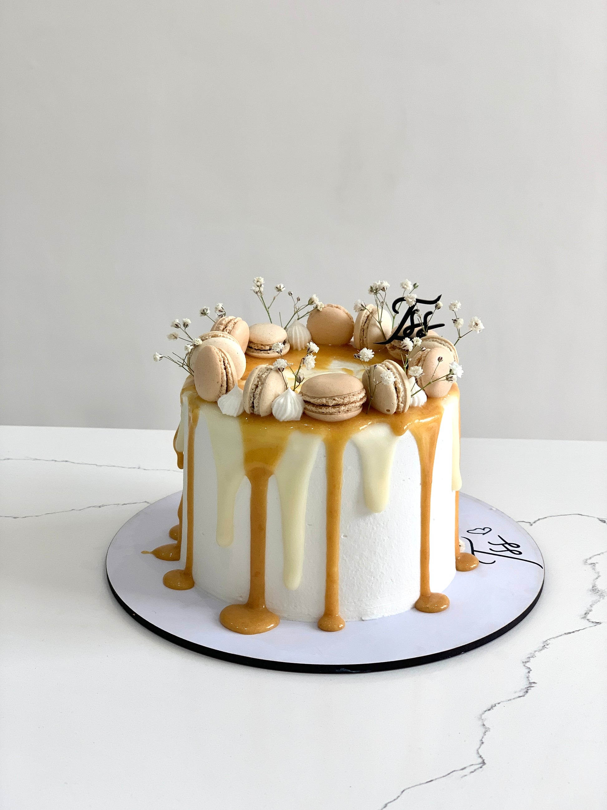 Classic cakes from The Sinful Spoon featuring layered dessert with frosting and decorative toppings on a plate.