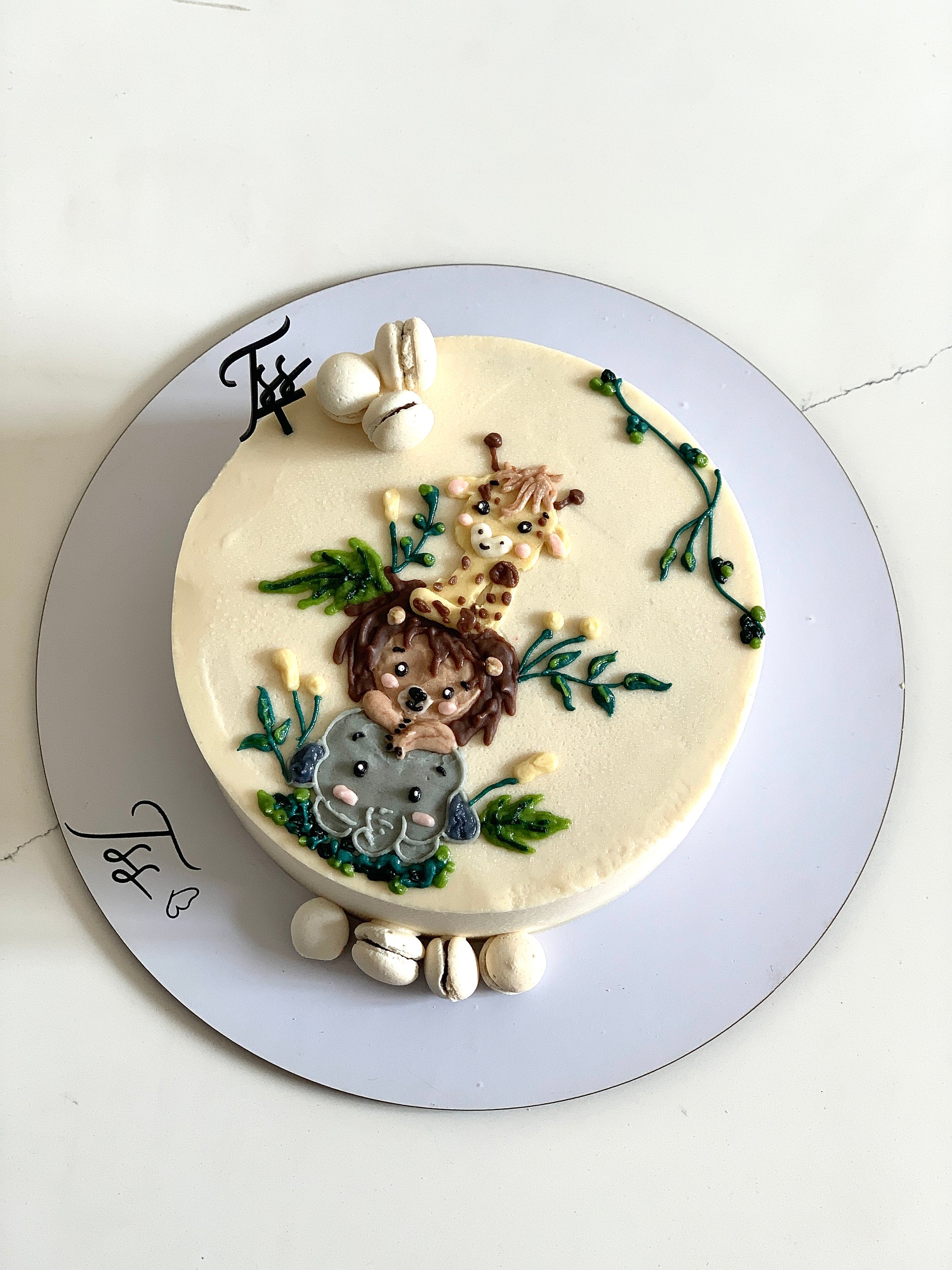 Decorative buttercream illustration cake by The Sinful Spoon with intricate floral and artistic piping details.
