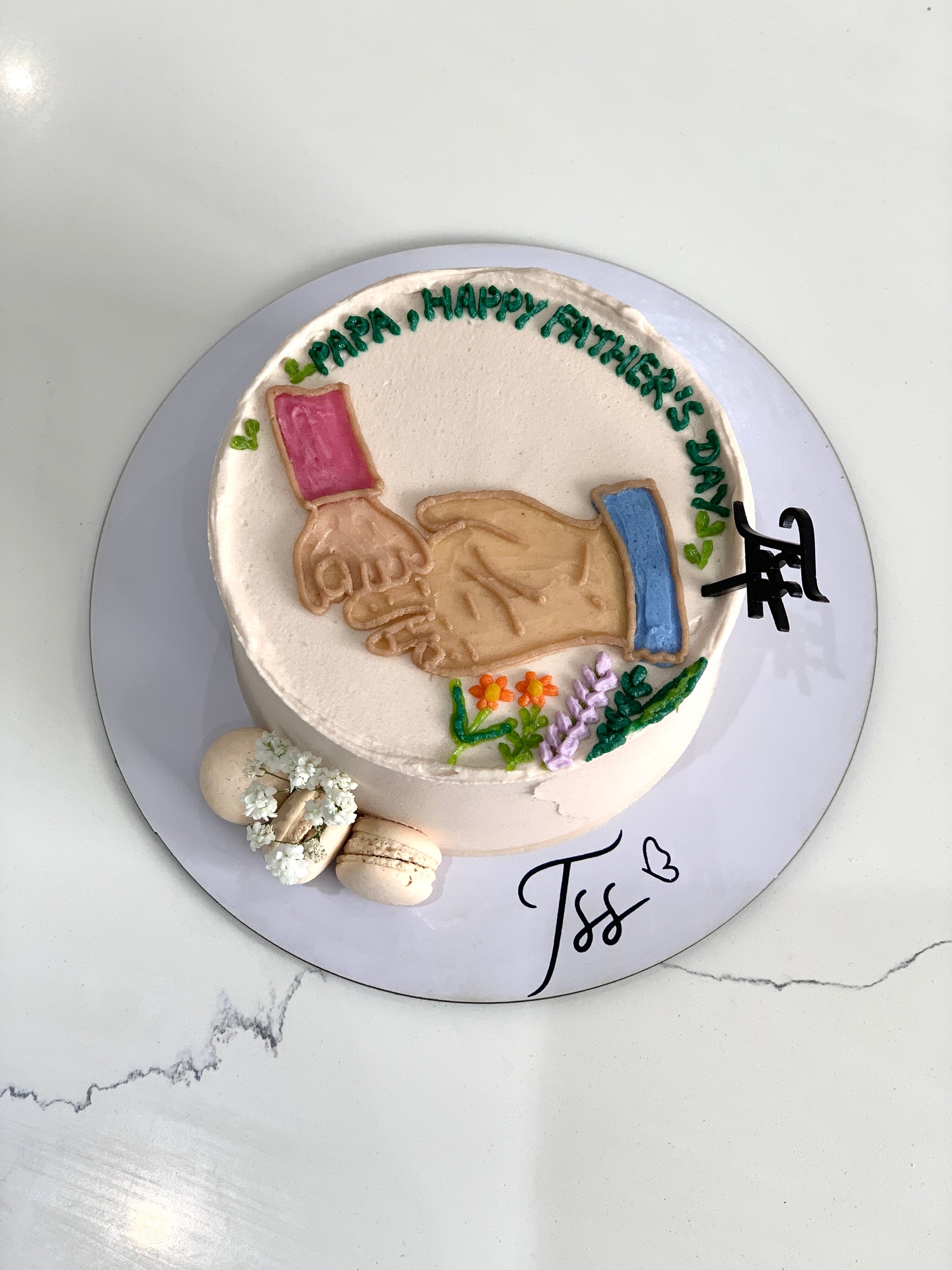 Chocolate Father’s Day cake from The Sinful Spoon with colorful decorations and festive icing, perfect for celebrating dad.
