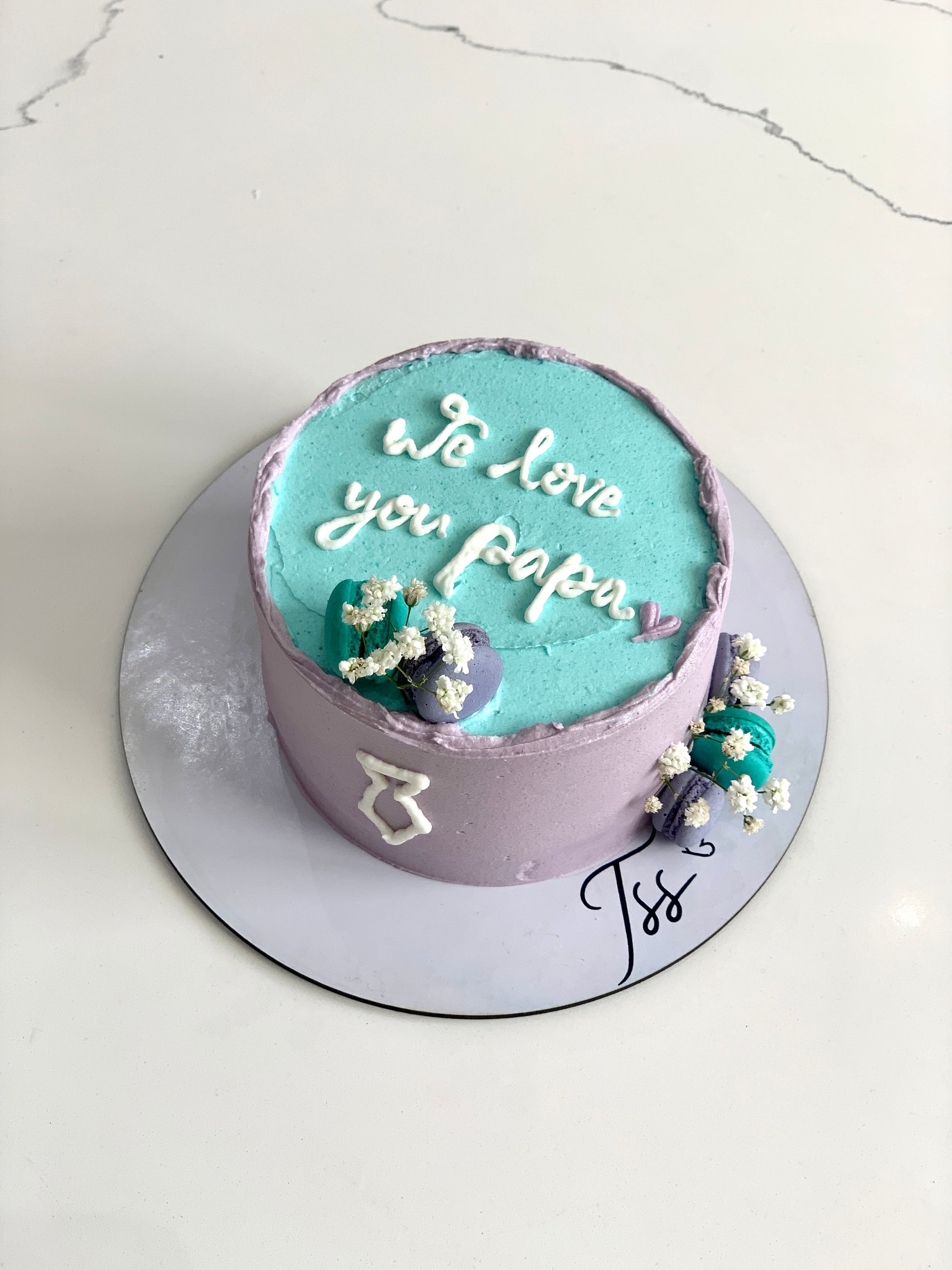 Decorative Father's Day cake from The Sinful Spoon with colorful frosting and themed design for celebrating dads.