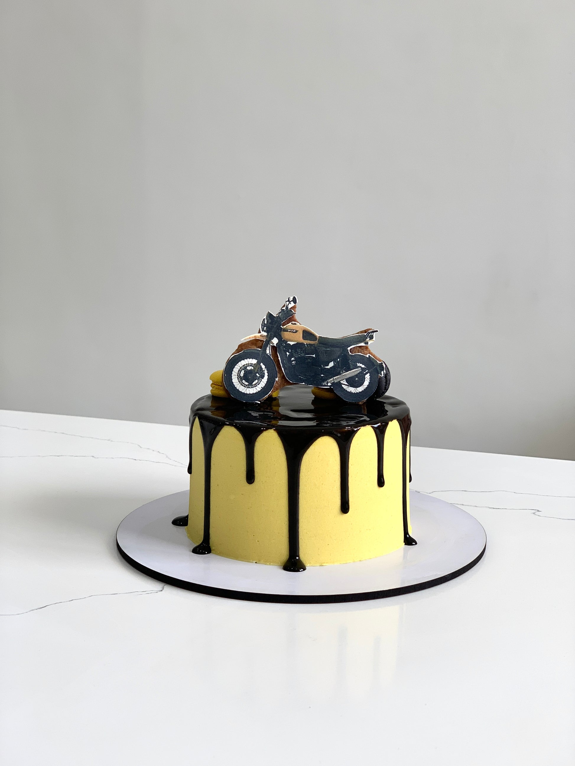 Edible paper cakes from The Sinful Spoon featuring colorful, decorative cake designs on thin edible sheets.