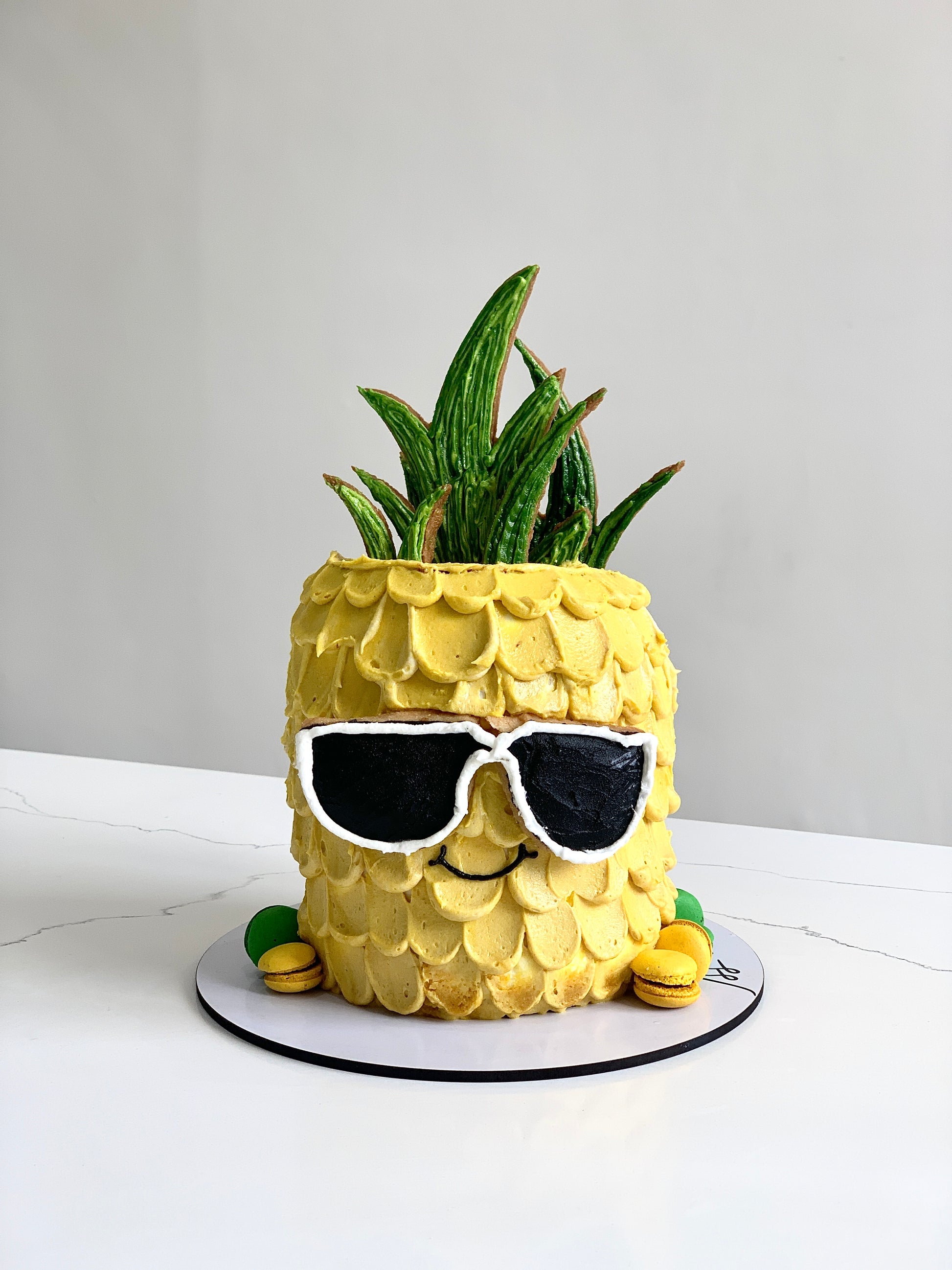 Colorful shape cakes from The Sinful Spoon with various fun geometric and character designs for celebrations and desserts.