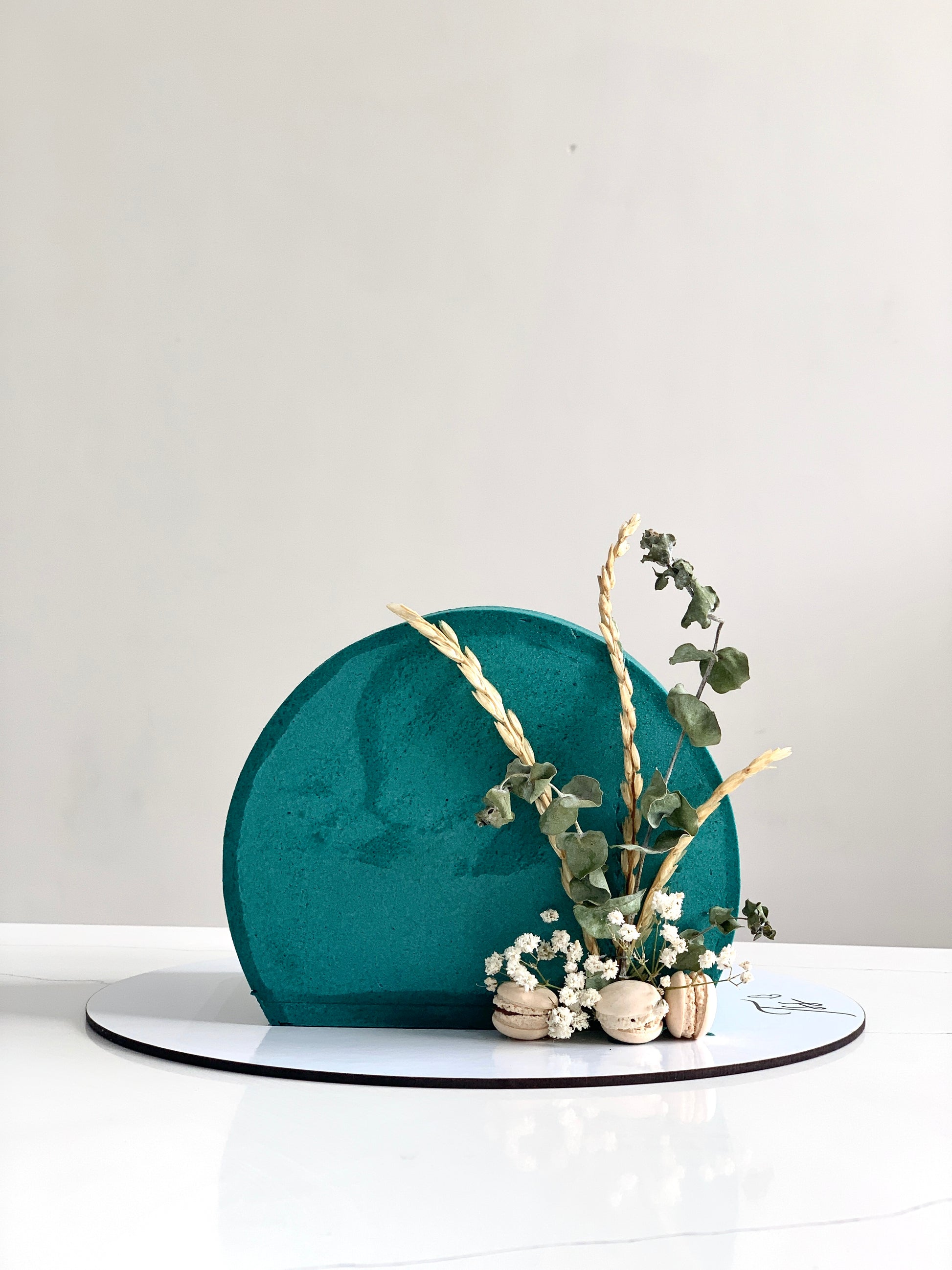 Inverted cakes by The Sinful Spoon featuring colorful layered desserts with decorative frosting and vibrant toppings.
