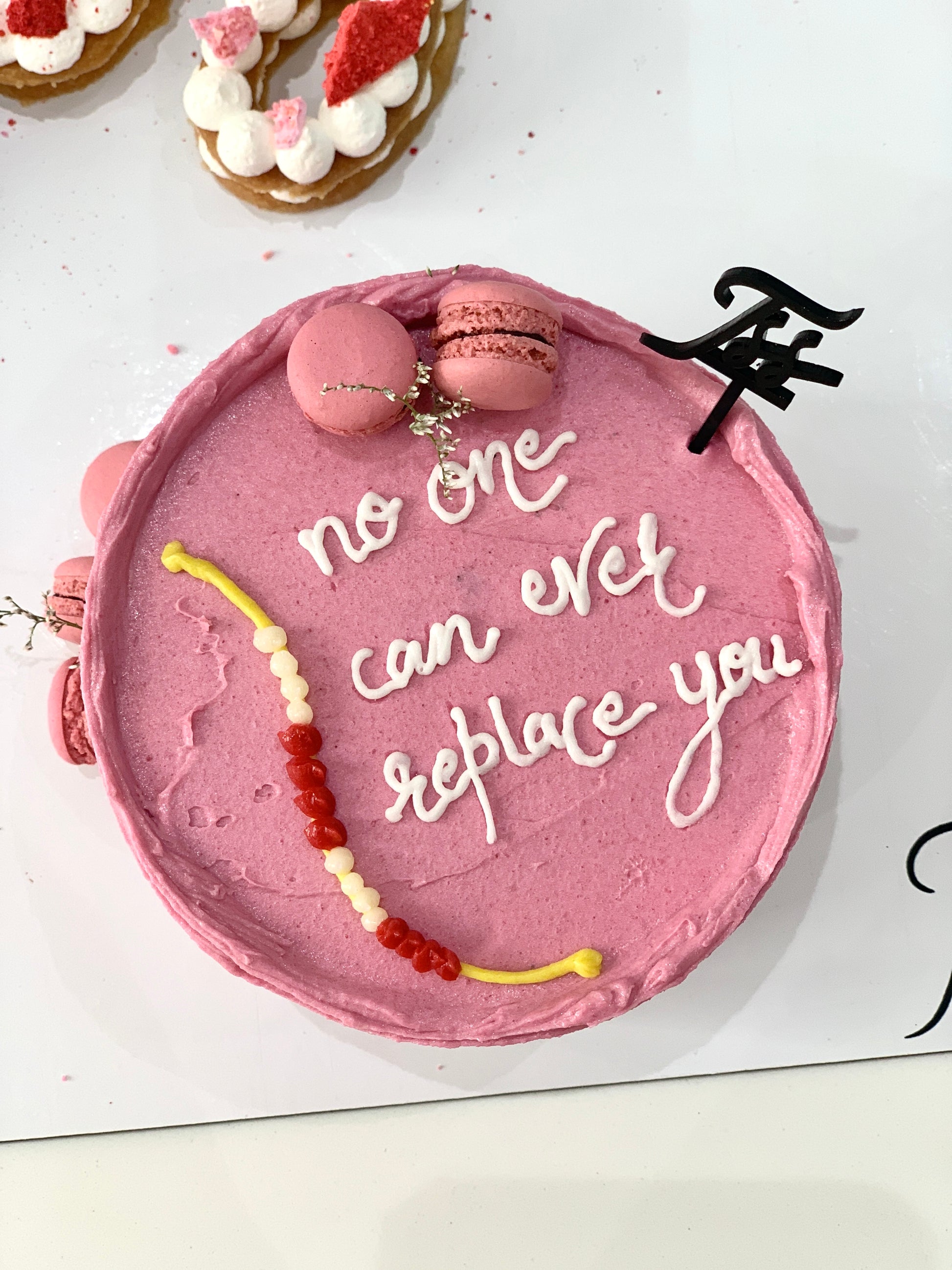 Colorful festive cakes from The Sinful Spoon with decorative icing and toppings, perfect for celebrations and special occasions.