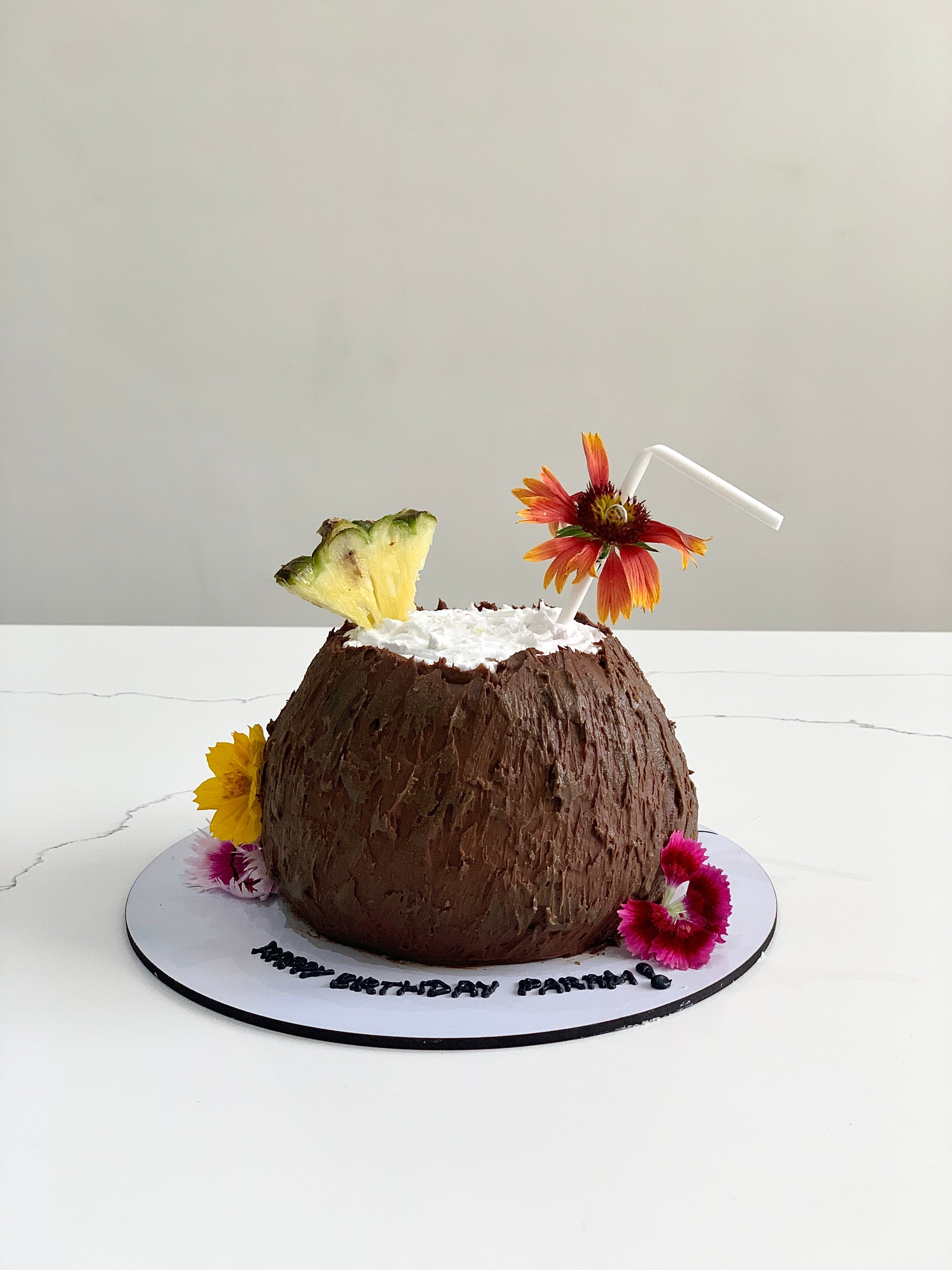 Decorative shape cakes from The Sinful Spoon featuring colorful, intricate designs on cake surfaces.