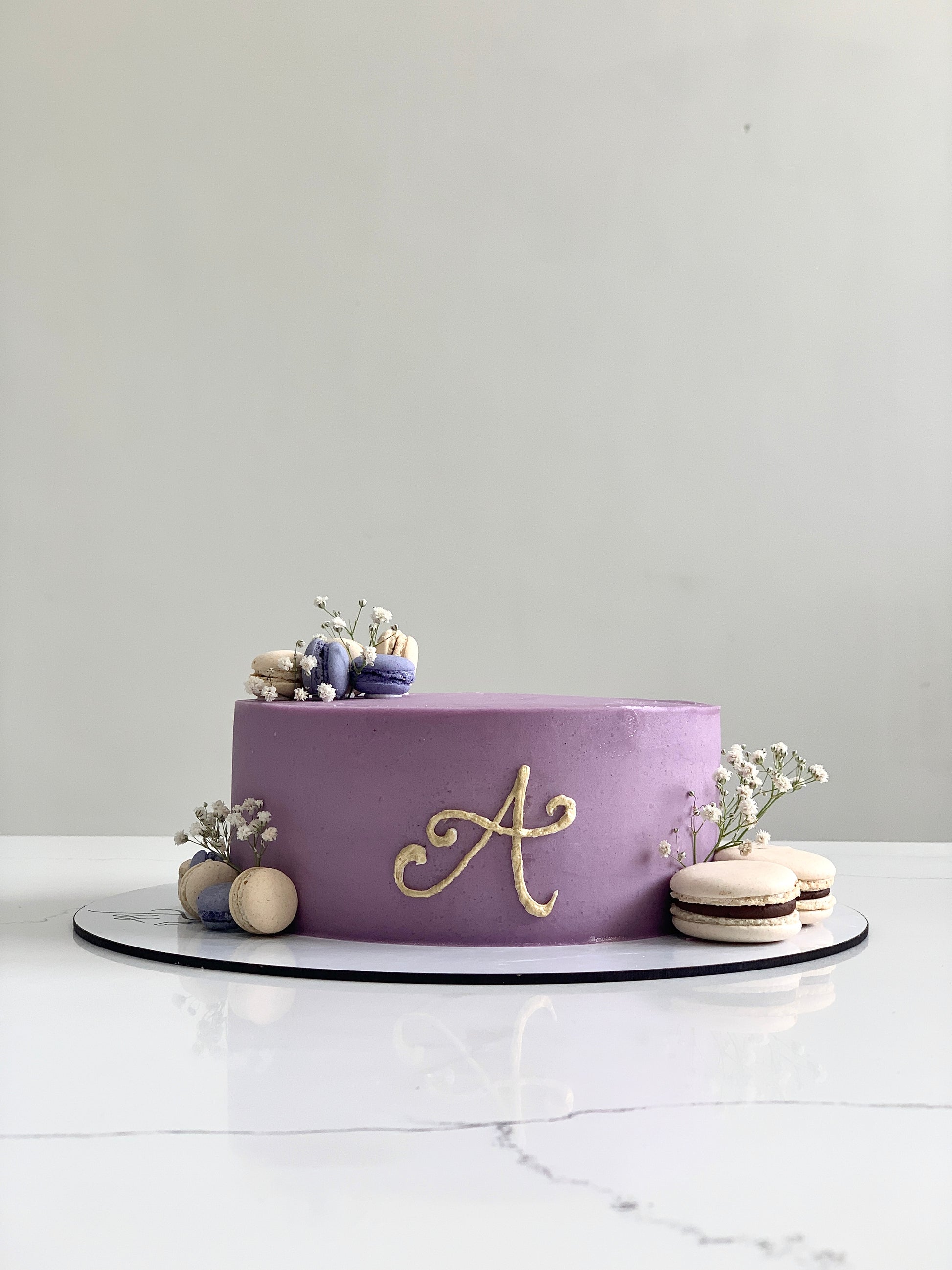 Classic cakes from The Sinful Spoon, showcasing a variety of colorful, freshly baked layered desserts with frosting and decorations.