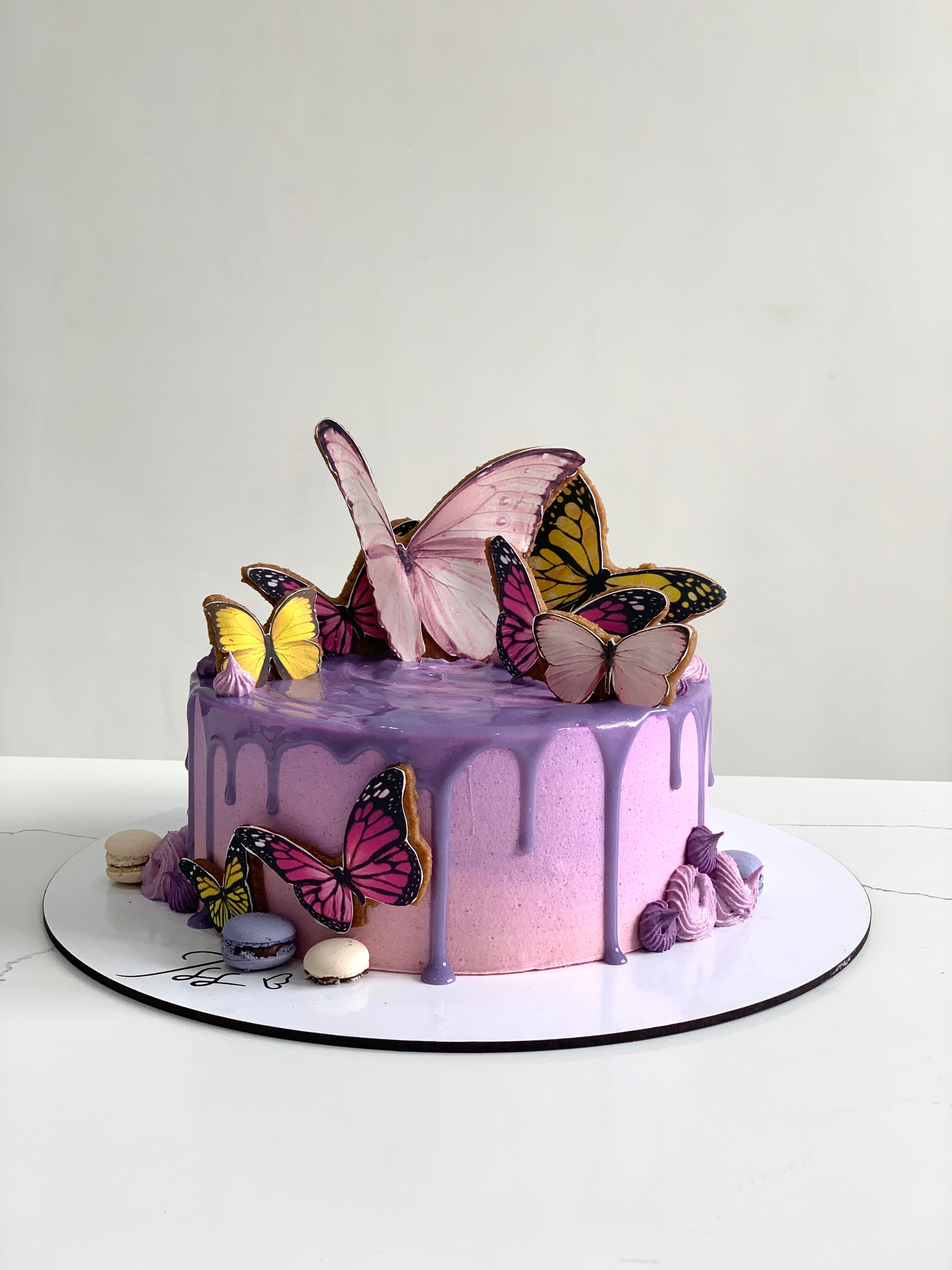 Edible paper cake topper for baby girl celebration, featuring pink and white design by The Sinful Spoon