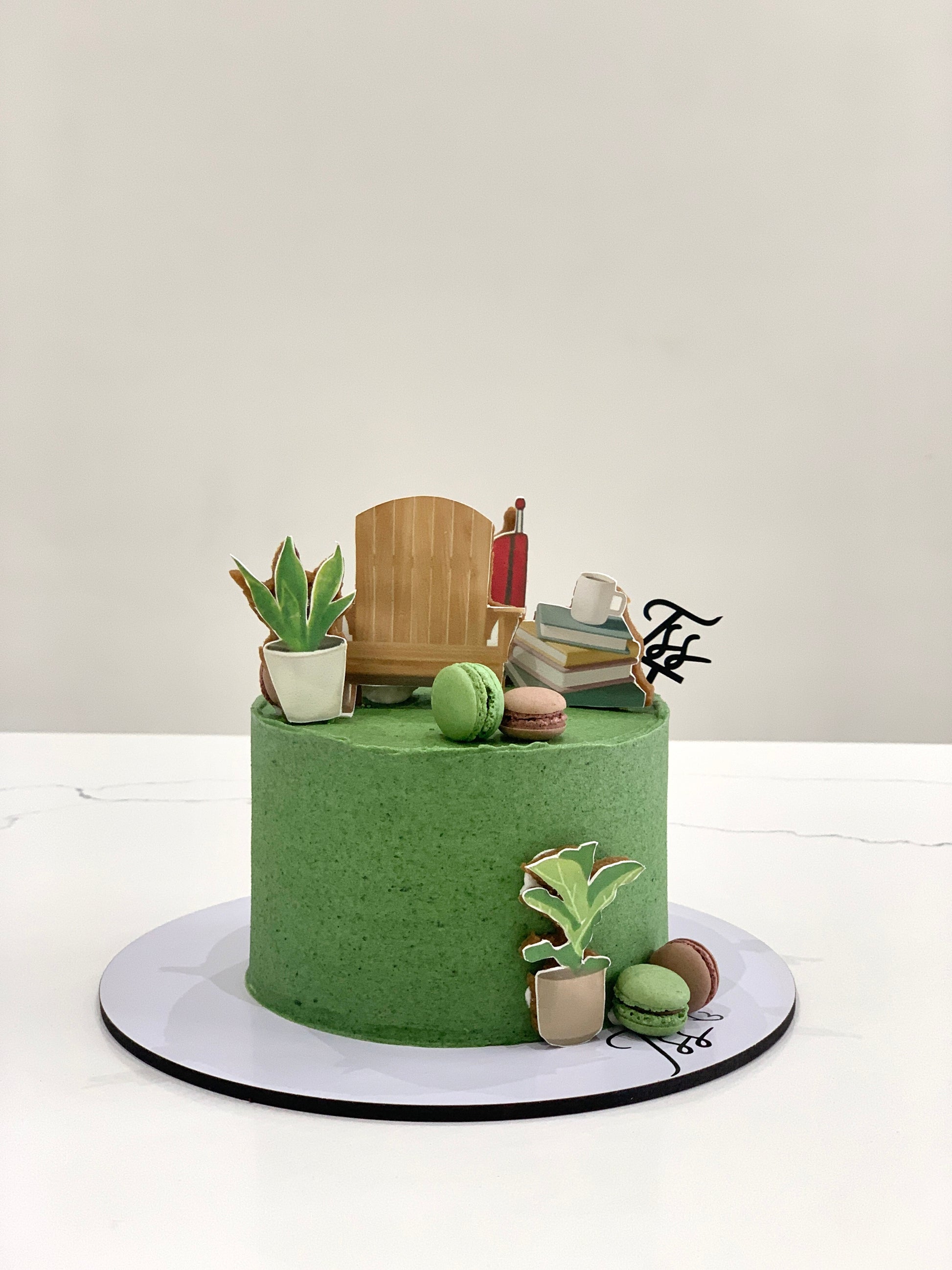 Edible paper cakes from The Sinful Spoon with colorful, decorative cake toppers and intricate edible designs on top.