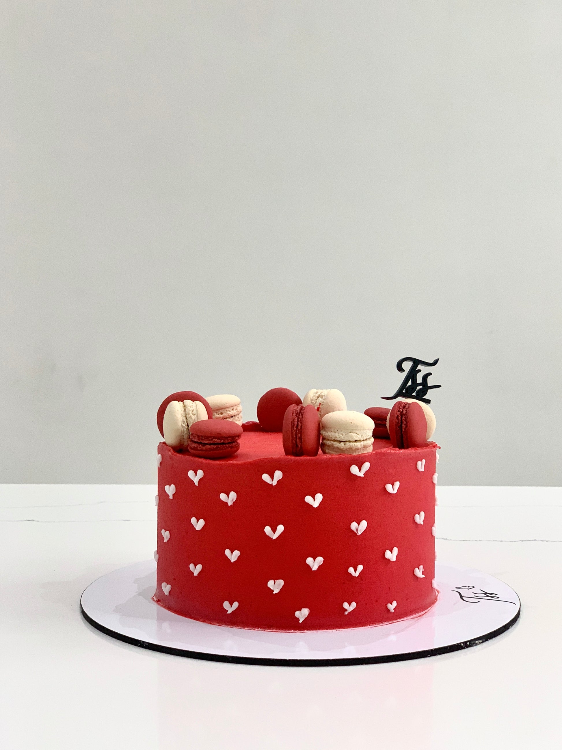 Classic cakes from The Sinful Spoon, featuring a variety of colorful, deliciously decorated cakes on a display tray.