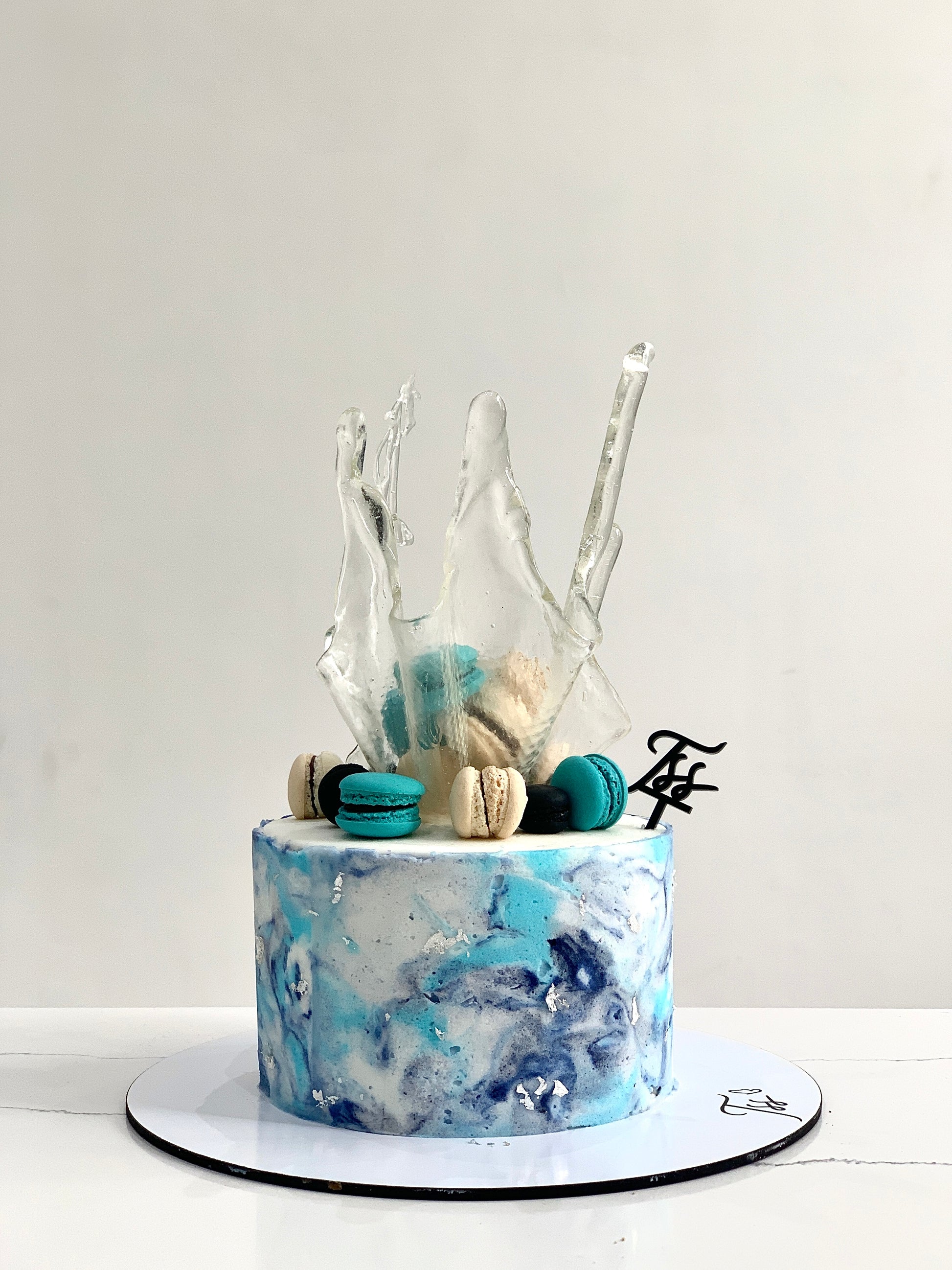 Isomalt cakes by The Sinful Spoon, translucent sugar candies with smooth, glossy surface for confectionery and decorating purposes.