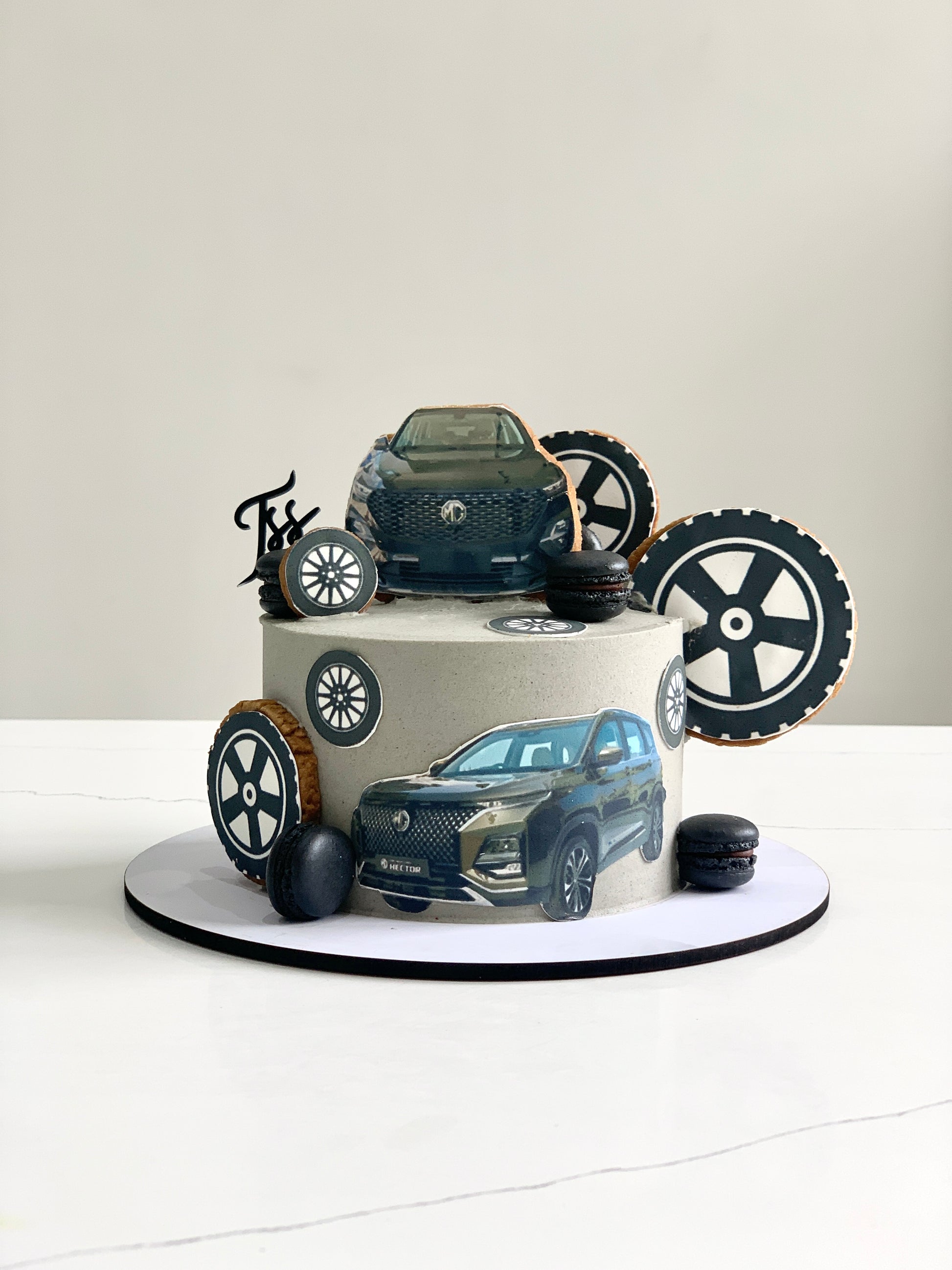 Edible paper cake with baby boy design from The Sinful Spoon, decorated with colorful details for a themed celebration.