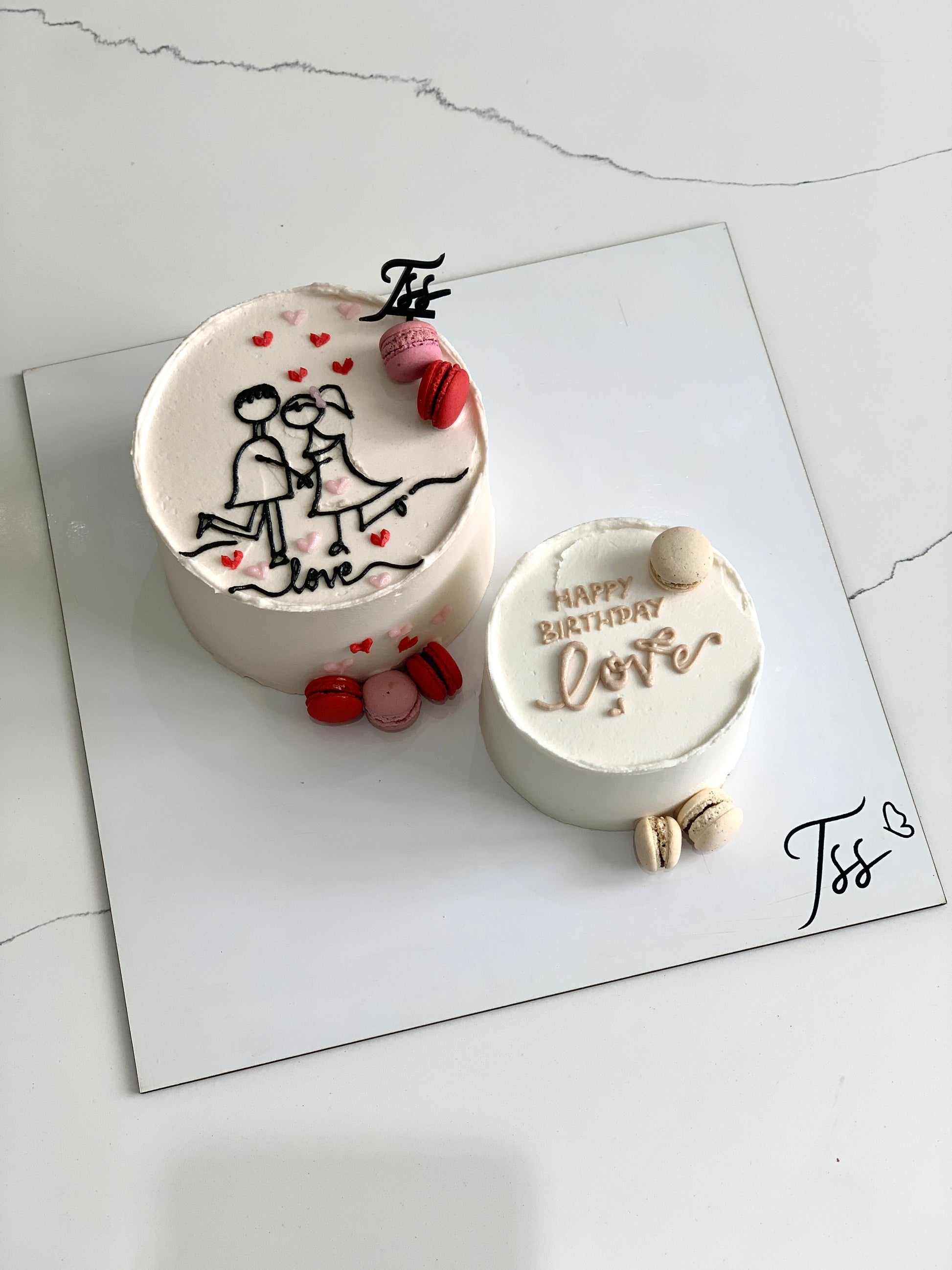 Assorted combo cakes from The Sinful Spoon, featuring layered and decorated desserts on a serving platter.