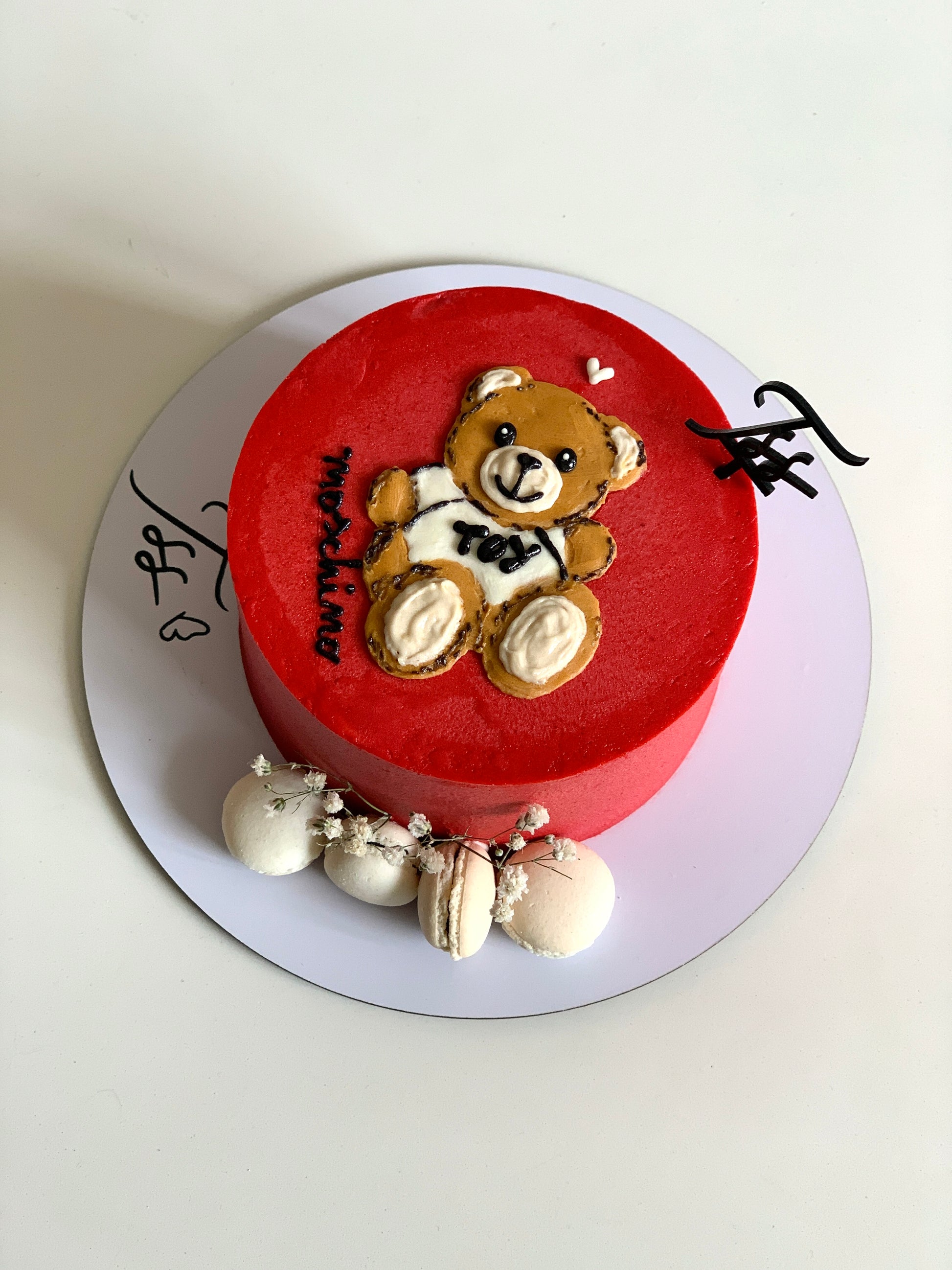 Colorful buttercream illustration cake by The Sinful Spoon with intricate floral and whimsical designs.