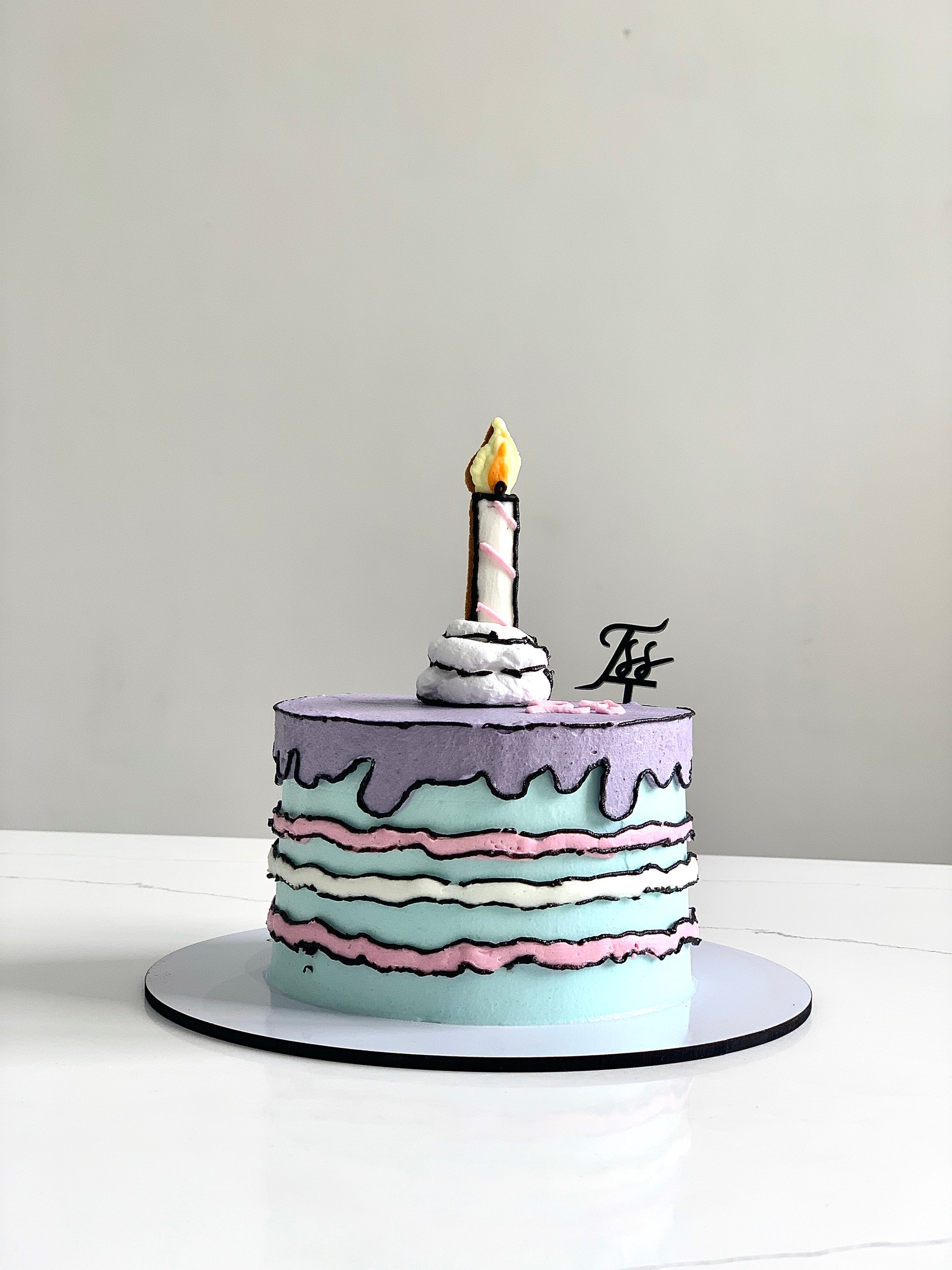 Colorful comic-themed cakes from The Sinful Spoon, featuring vibrant cartoon-inspired decorations and detailed icing designs.