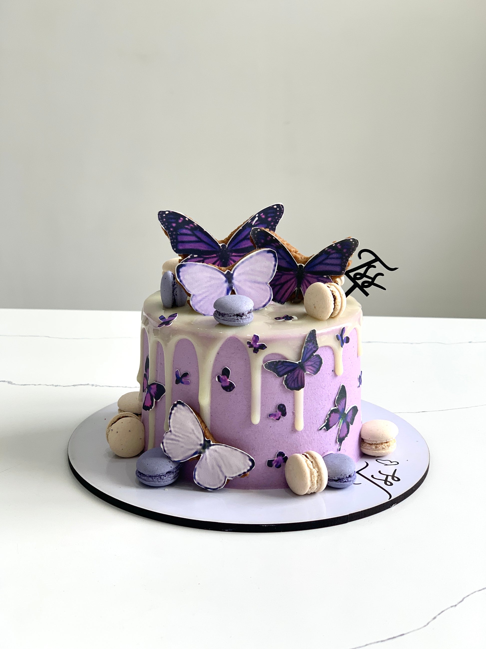 Edible paper cake topper for baby girl celebration, featuring colorful baby-themed design from The Sinful Spoon.