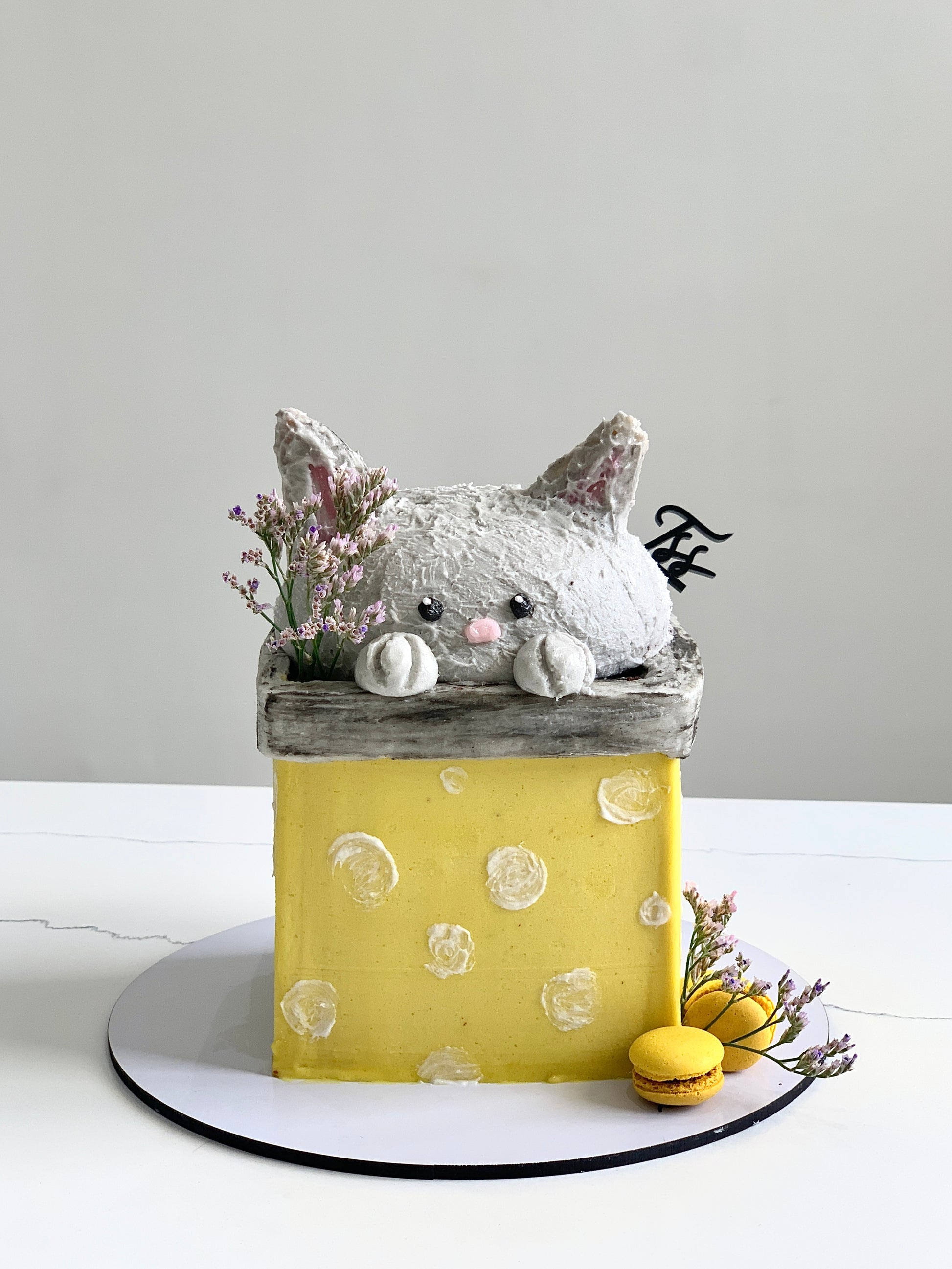 Decorative shaped cakes from The Sinful Spoon, featuring colorful, intricately designed cake shapes on a white background.
