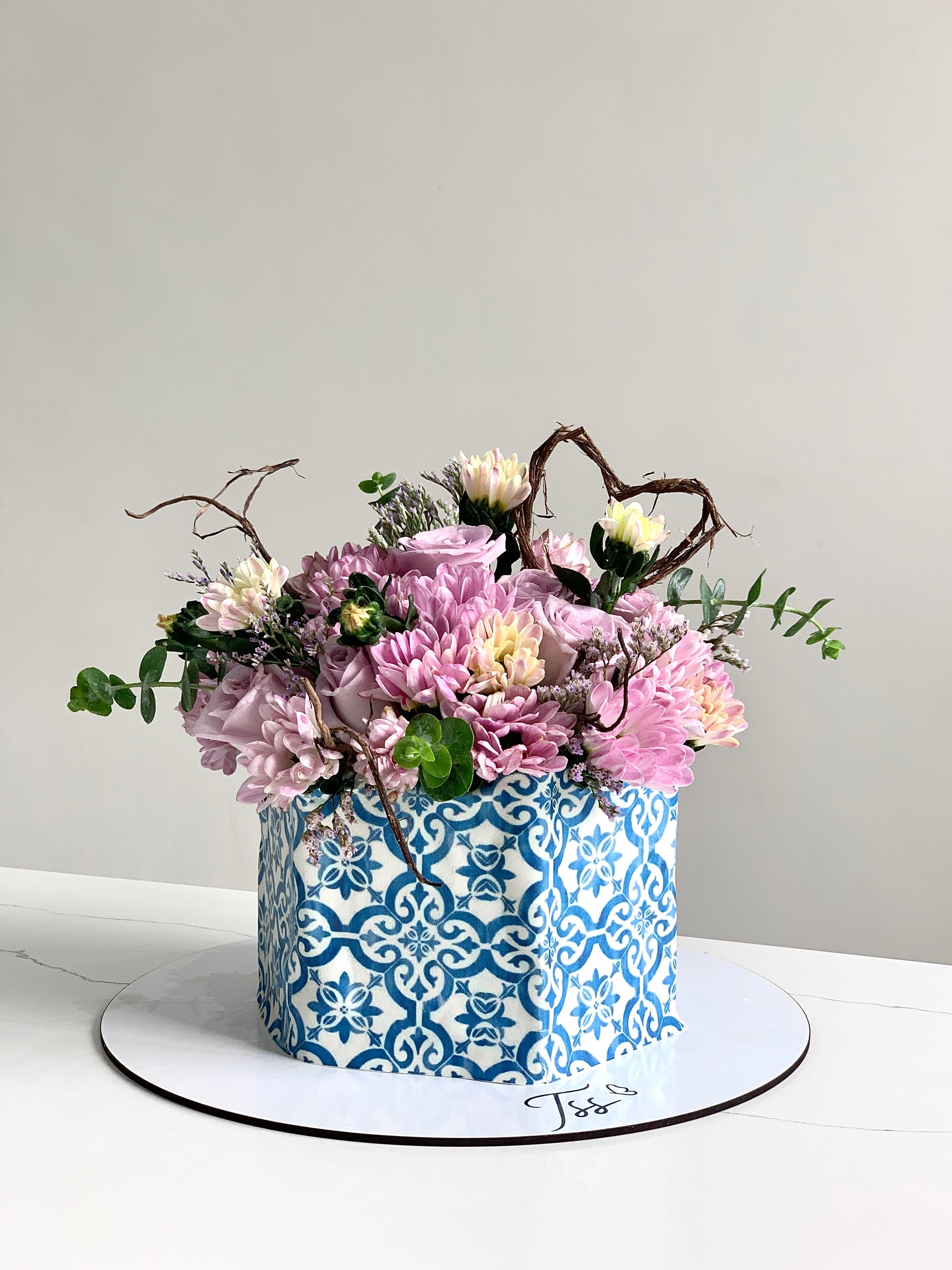 Fresh floral cakes from The Sinful Spoon featuring colorful, beautifully decorated cakes with vibrant floral designs.