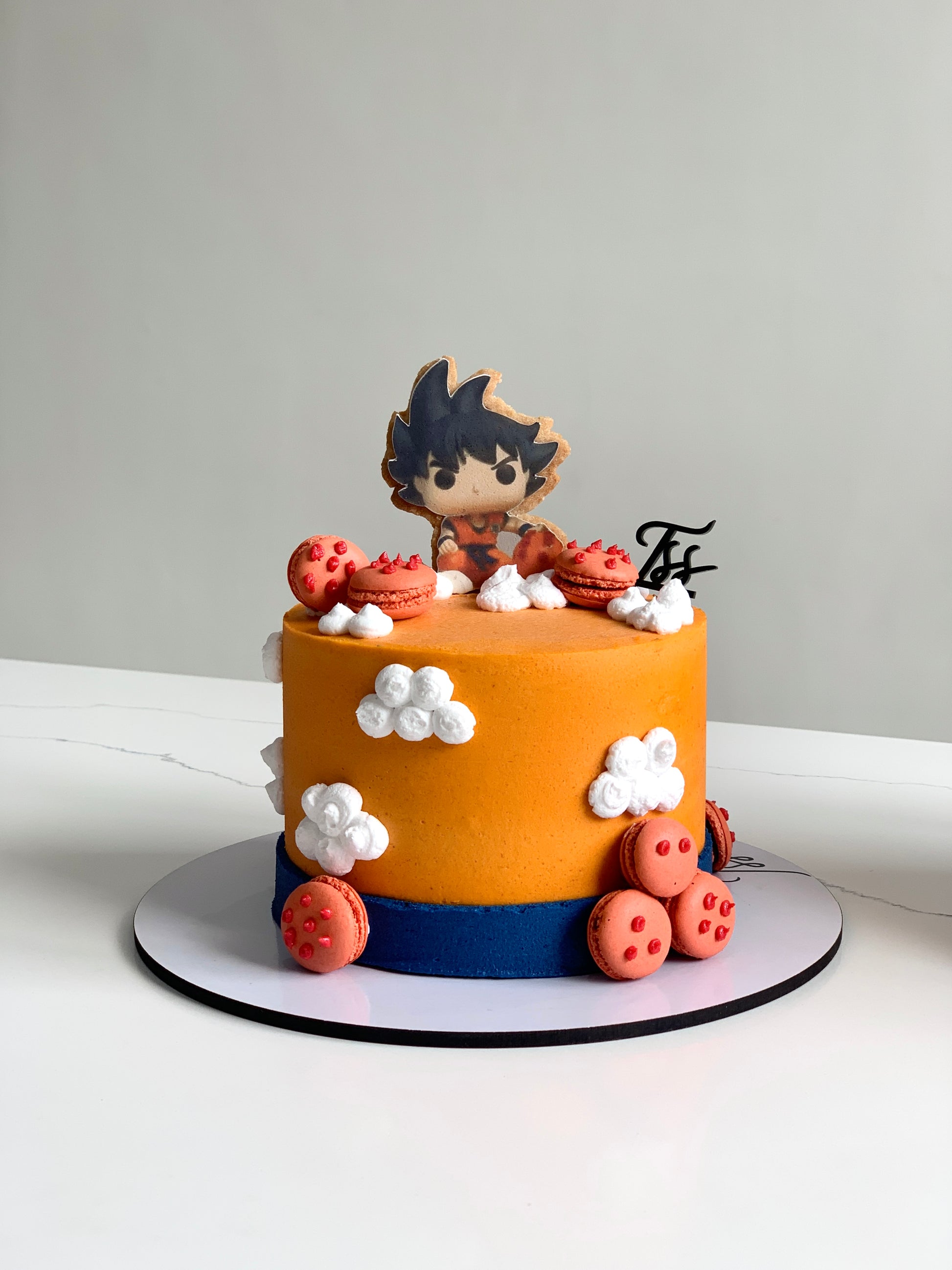 Edible paper cake decorated for a baby boy celebration by The Sinful Spoon, featuring colorful baby-themed designs.