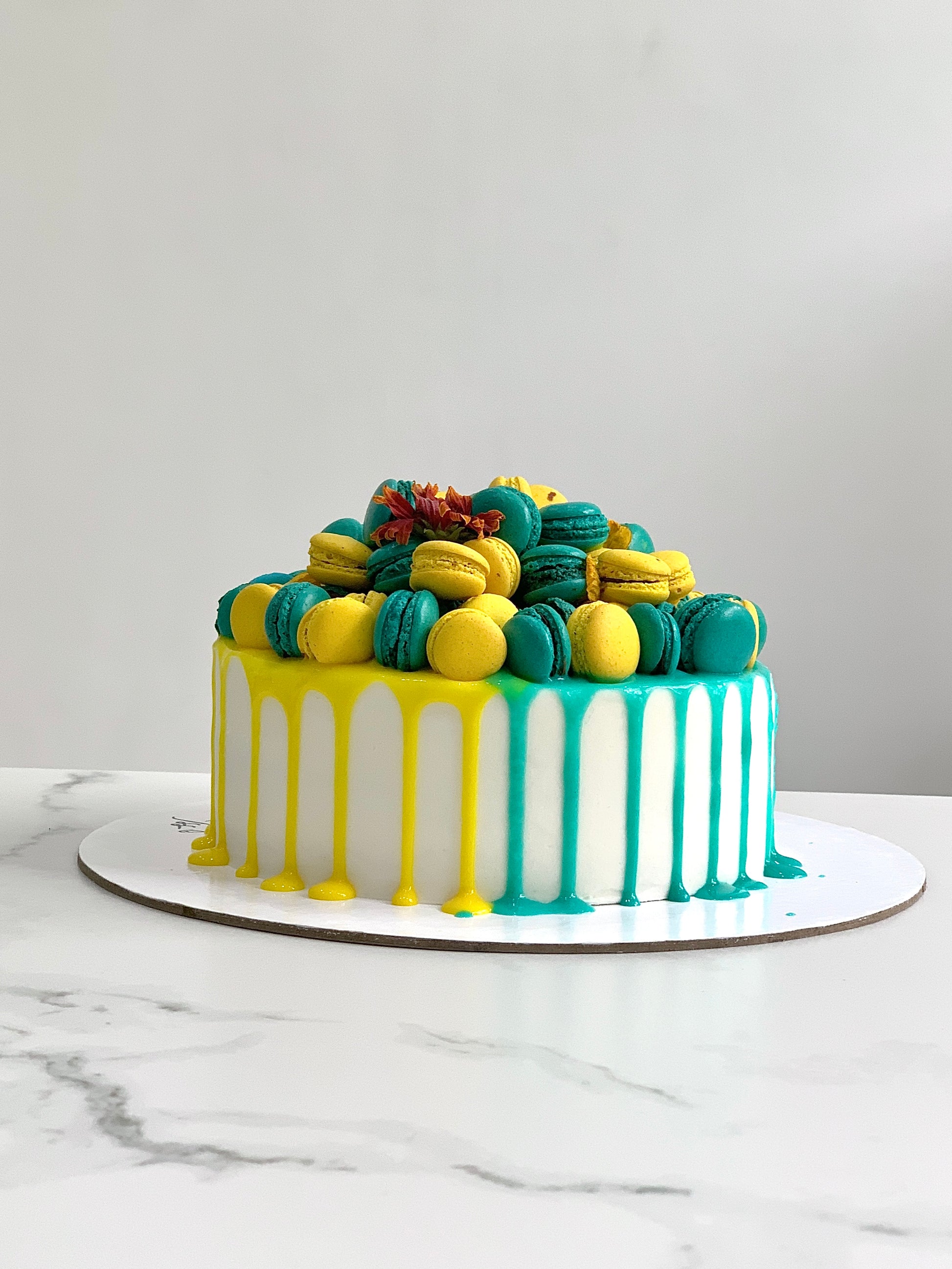 Classic Cakes by The Sinful Spoon displayed on a plate with colorful sprinkles and frosting, showcasing a delicious homemade dessert.