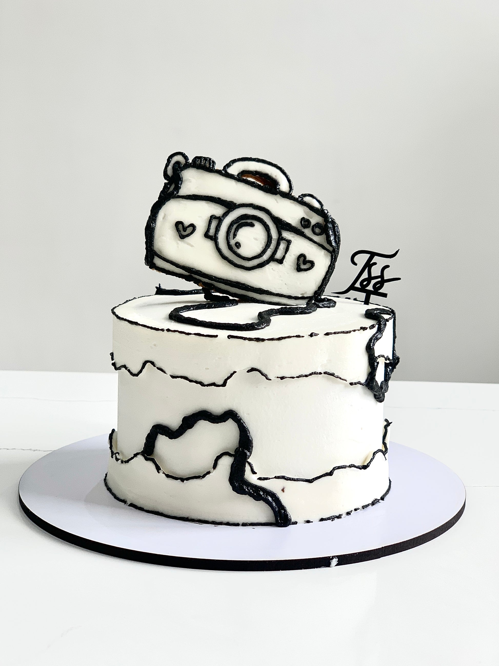 Colorful comic cake decorated with vibrant icing and fun character toppers, created by The Sinful Spoon.