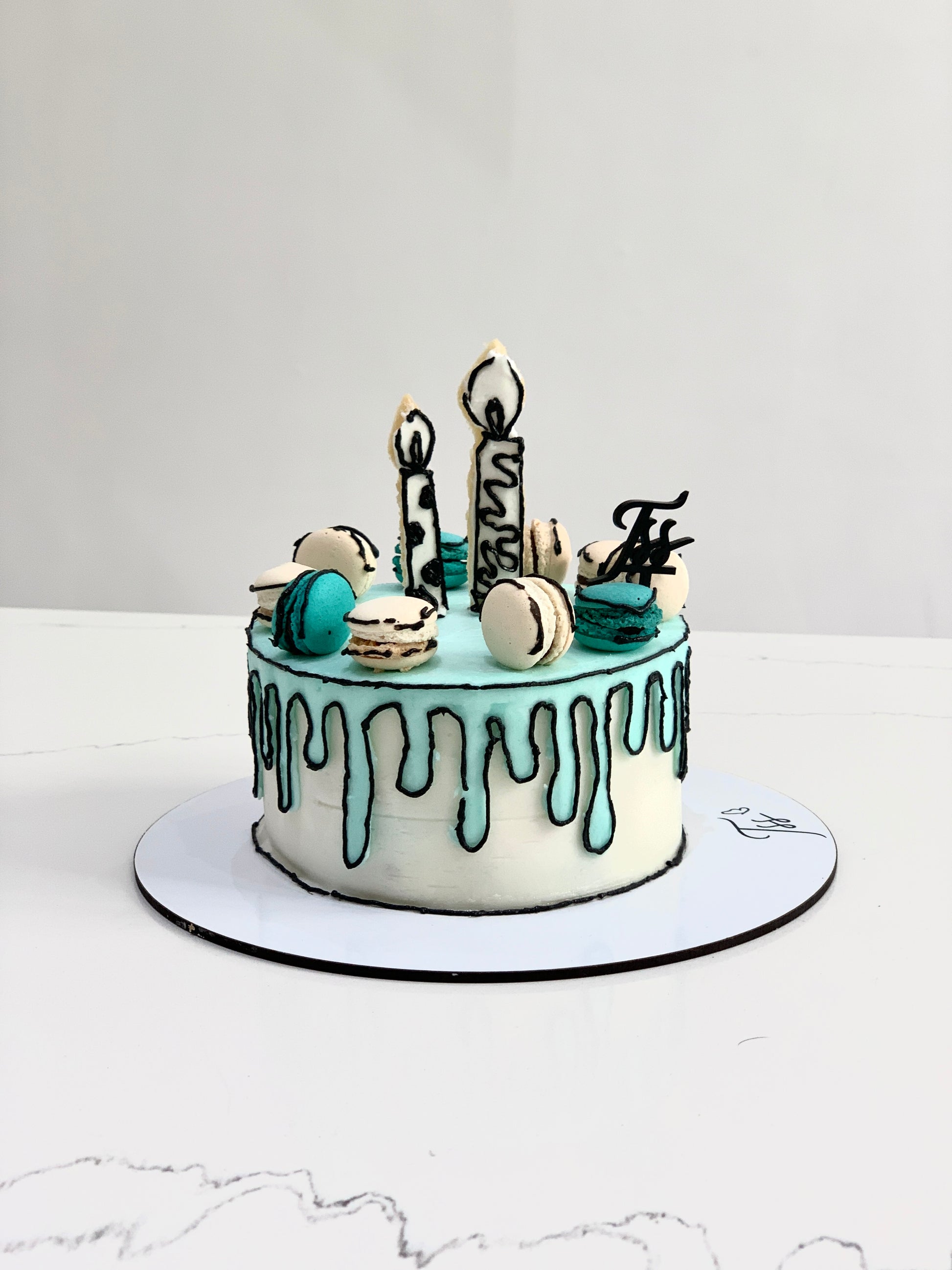 Colorful comic-themed cakes from The Sinful Spoon with vibrant icing and playful designs, perfect for celebrations.