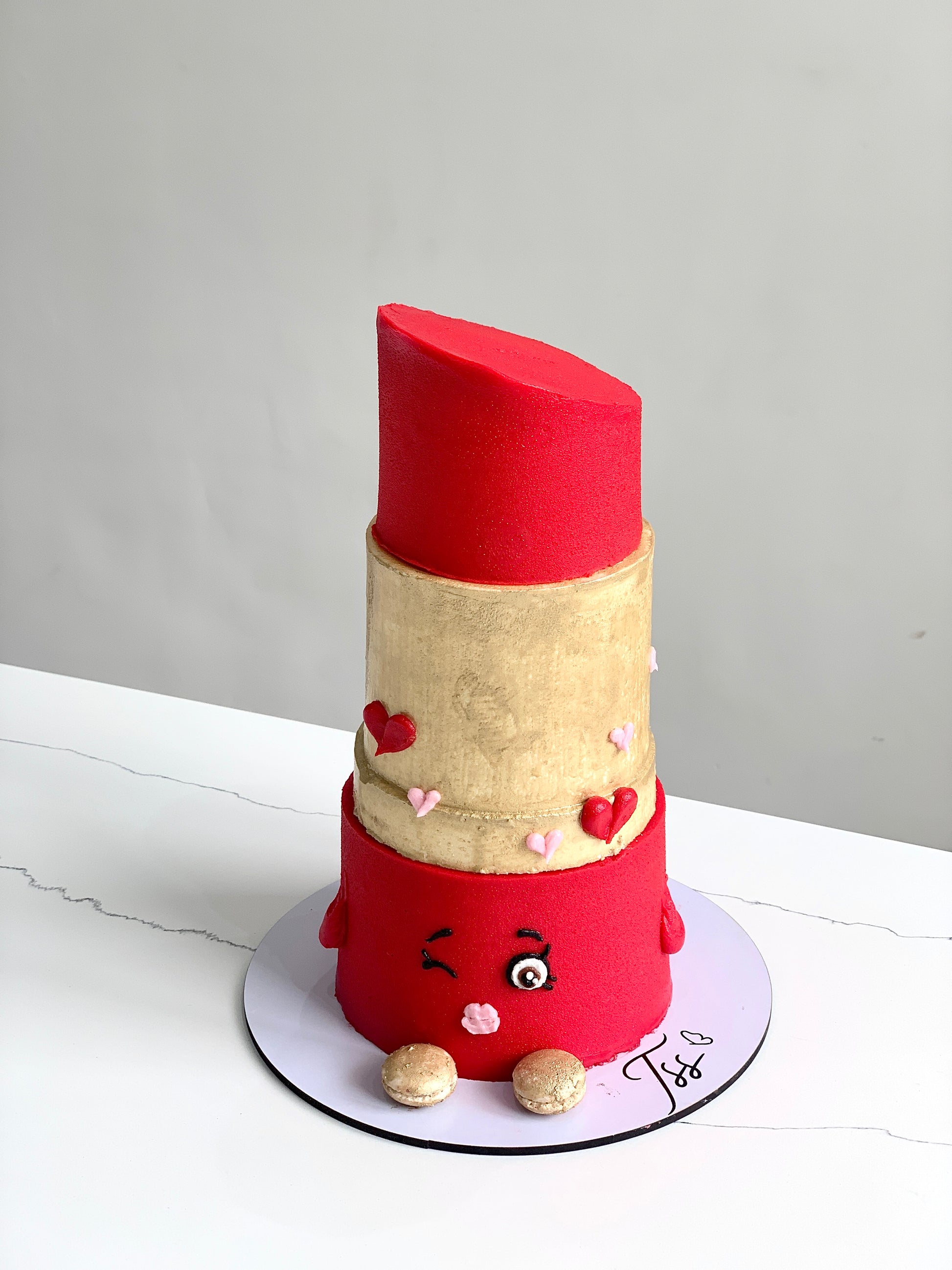 Decorative shape cakes from The Sinful Spoon, showcasing colorful, intricately designed cake shapes on a clean background.