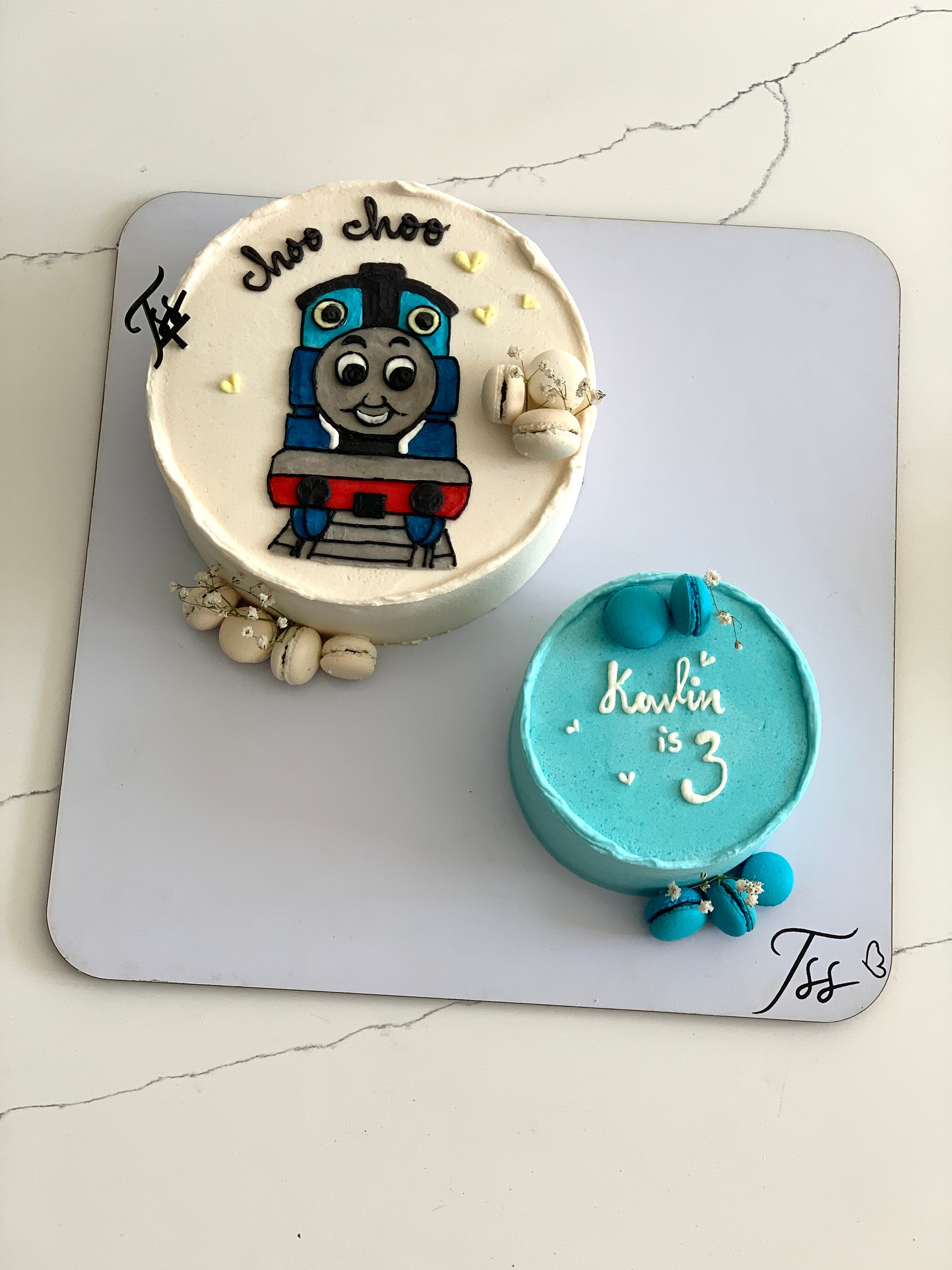 Buttercream illustration cake by The Sinful Spoon with colorful floral and artistic piping details on a decorated cake.