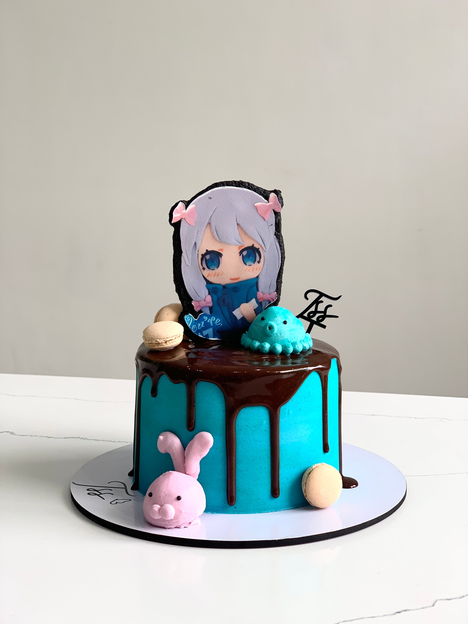Edible paper cake topper featuring a baby girl design from The Sinful Spoon for celebration cakes.