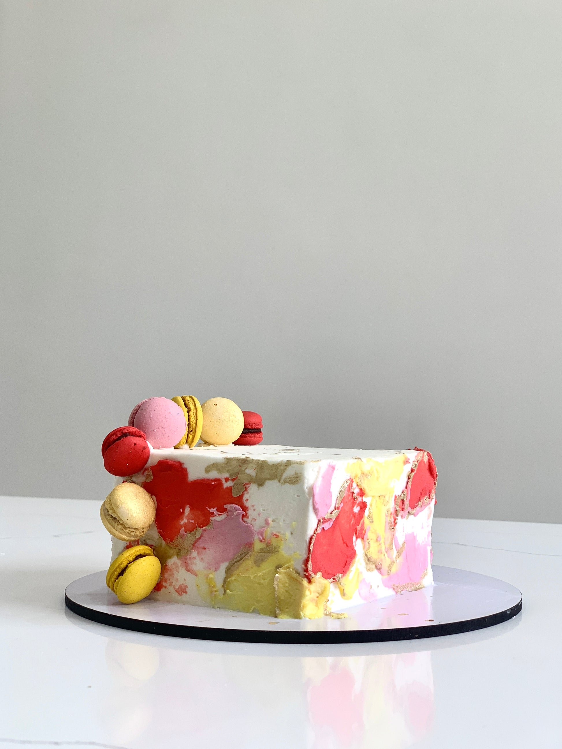 Colorful shape cakes from The Sinful Spoon, featuring vibrant, whimsical designs perfect for celebrations and special occasions.