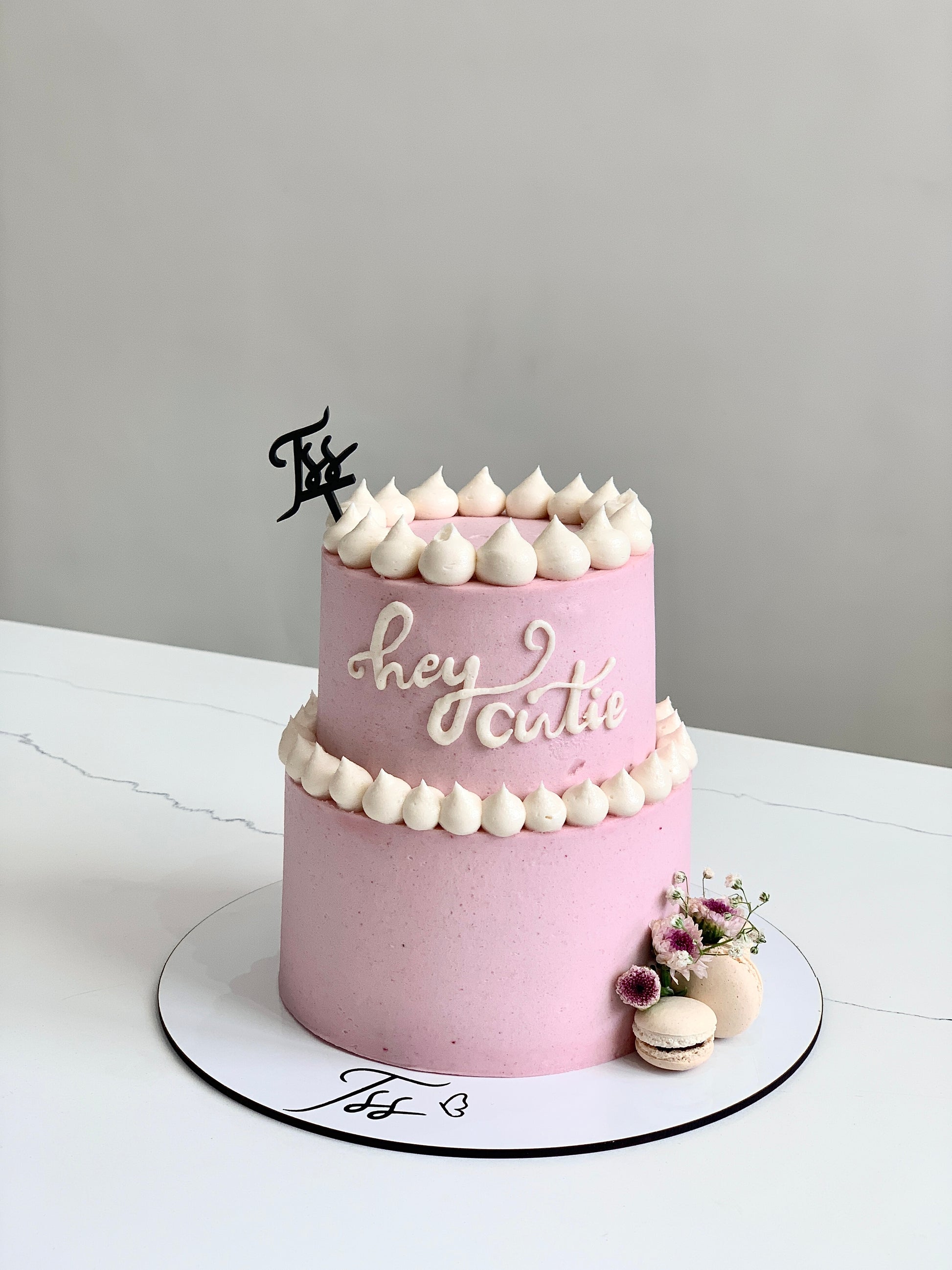 Mini tier cakes from The Sinful Spoon, showing colorful layered cakes with intricate frosting details.