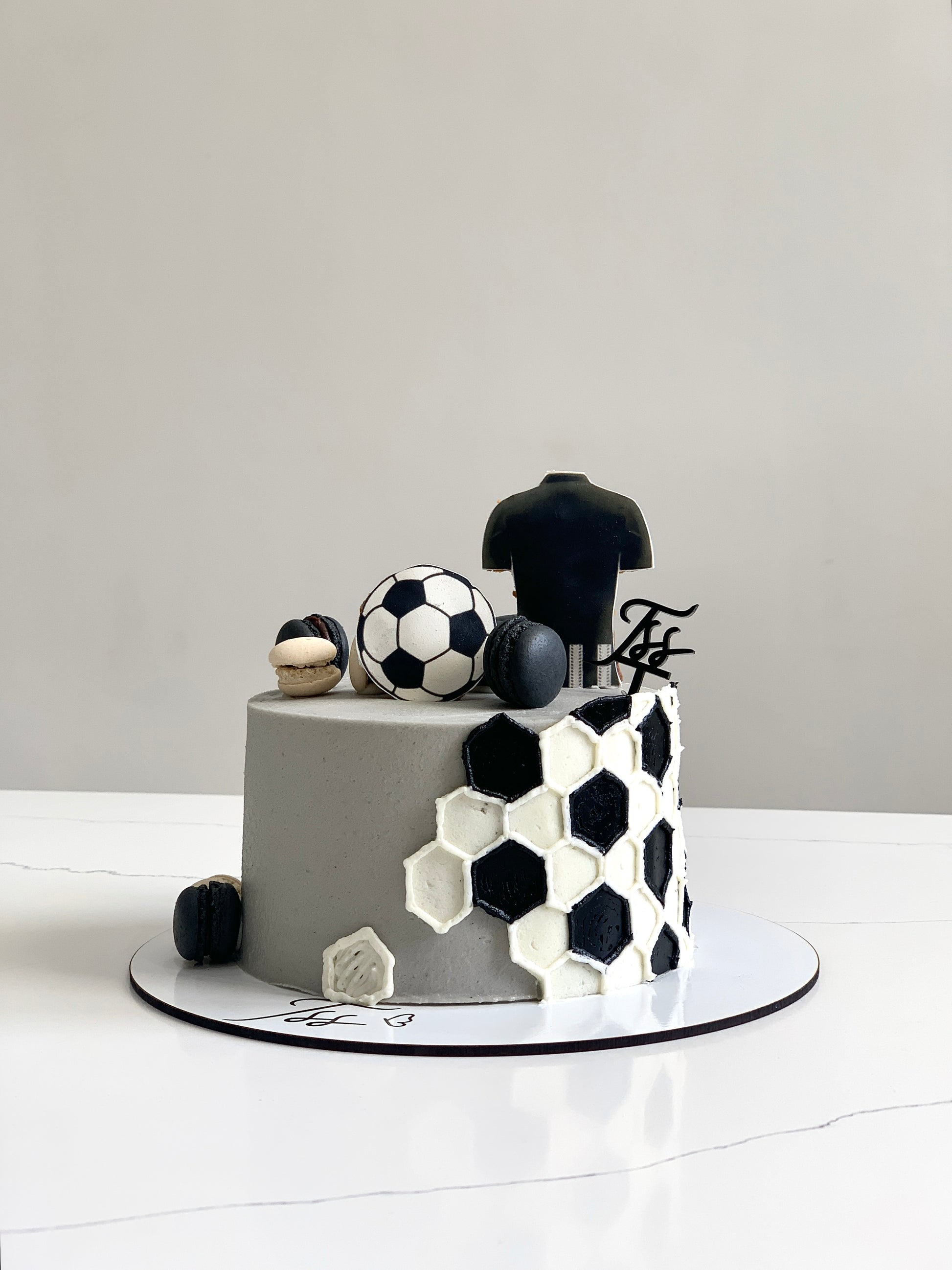 Edible paper cake for baby boy by The Sinful Spoon, decorated with blue and white baby-themed designs and cute edible toppers.