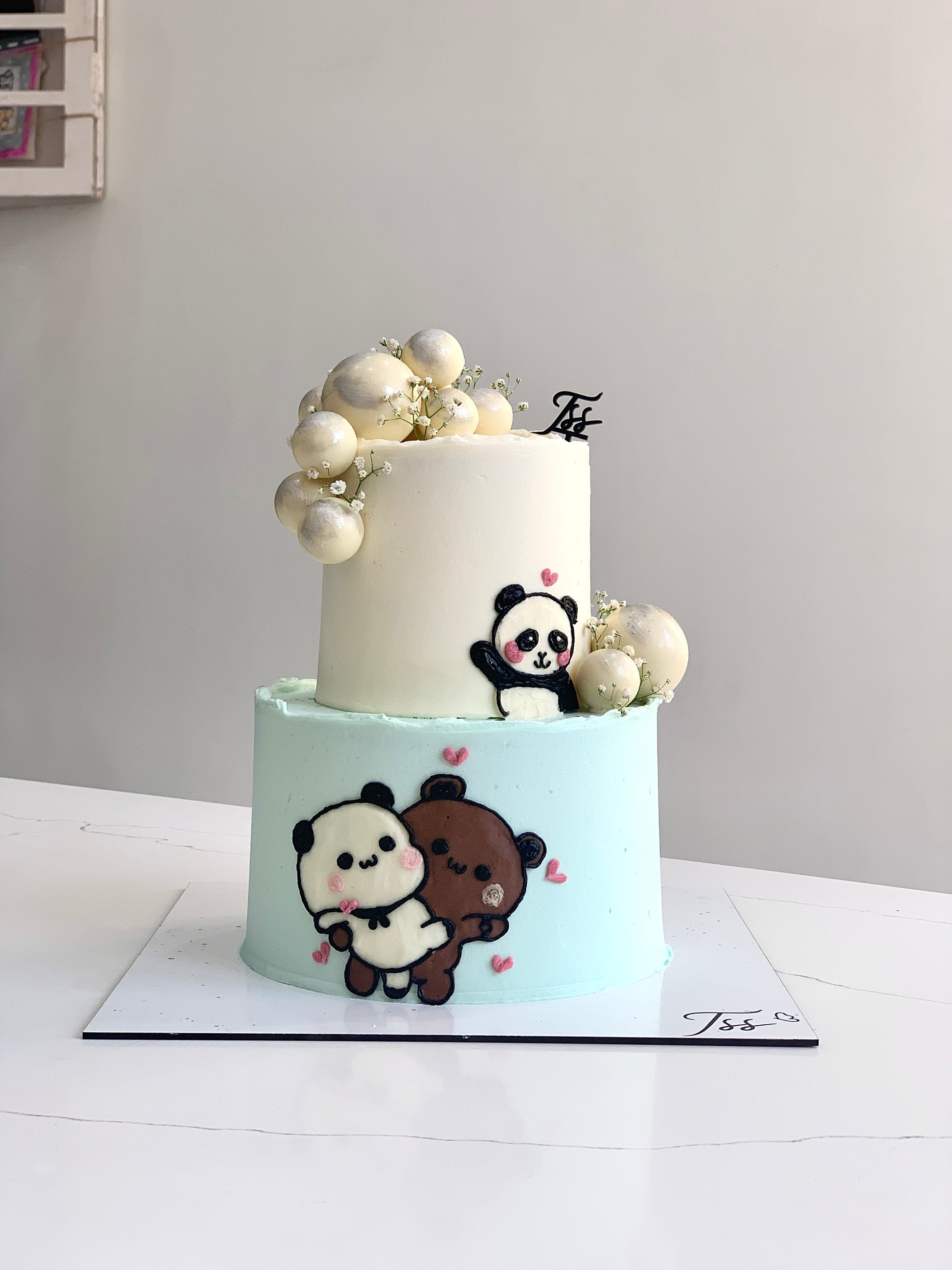 Colorful tiered kids' cake from The Sinful Spoon with vibrant frosting and playful decorations, perfect for children's celebrations.