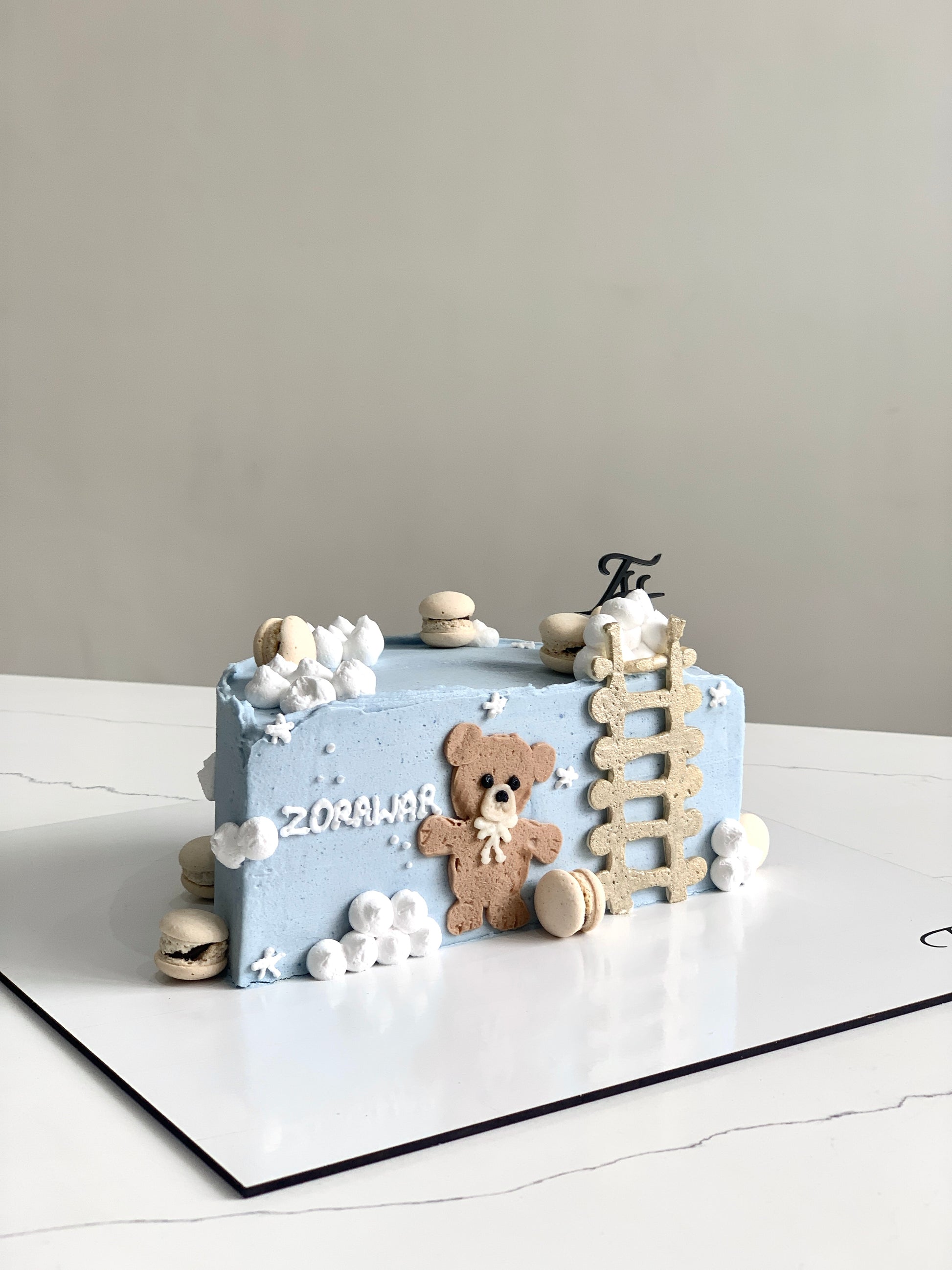 Decorative half birthday cakes from The Sinful Spoon with colorful frosting, sprinkles, and festive designs for celebration.