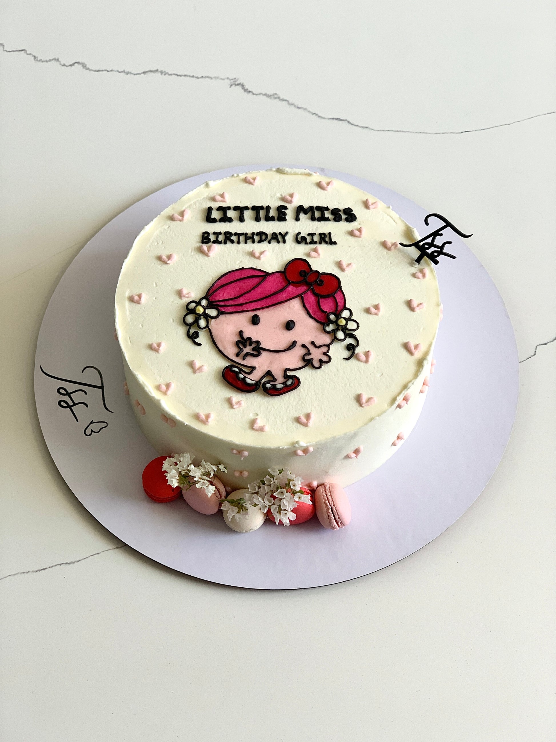 Decorative buttercream illustration cake by The Sinful Spoon featuring colorful floral and artistic piping details.