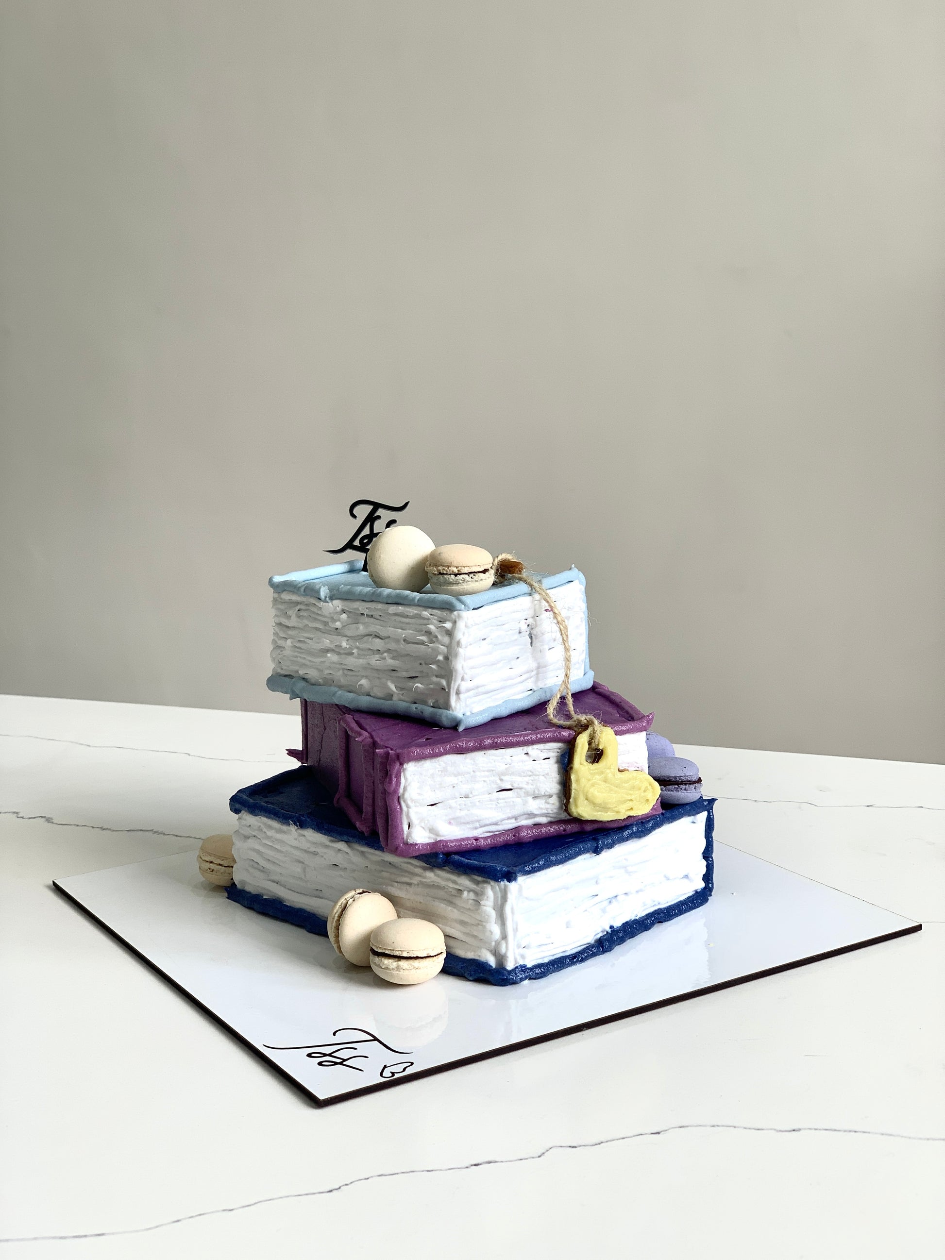 Colorful shape cakes from The Sinful Spoon, arranged with various fun and vibrant shapes on a white background.