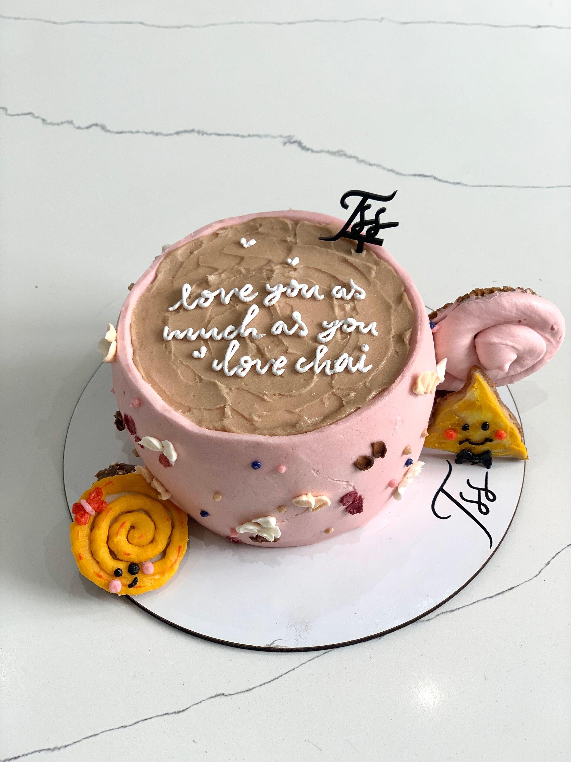 Shape cakes cup from The Sinful Spoon featuring a detailed, edible cake design in a mug shape on a white background.