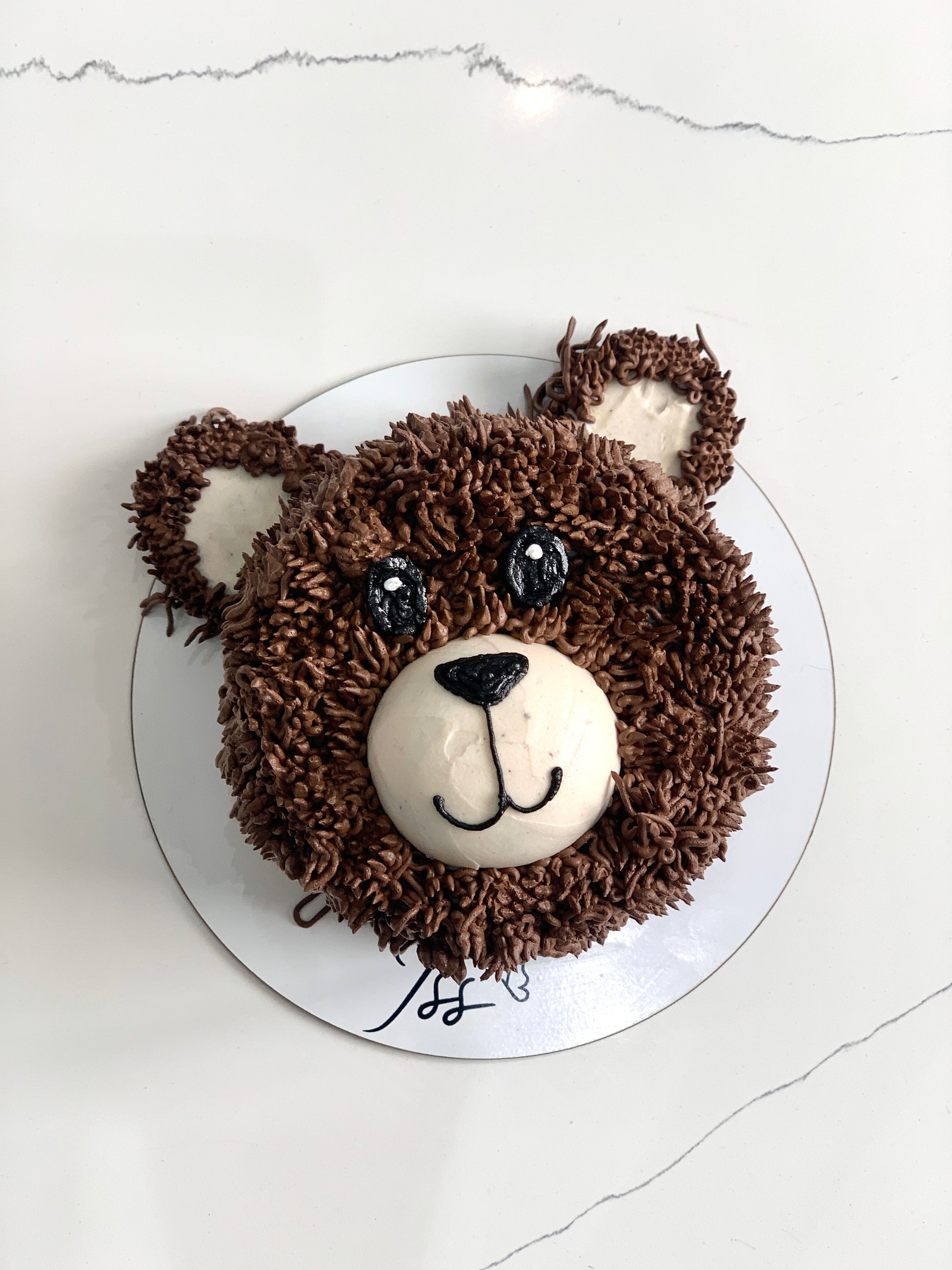 Decorative shape cakes by The Sinful Spoon featuring colorful, intricate designs perfect for celebrations and special occasions.