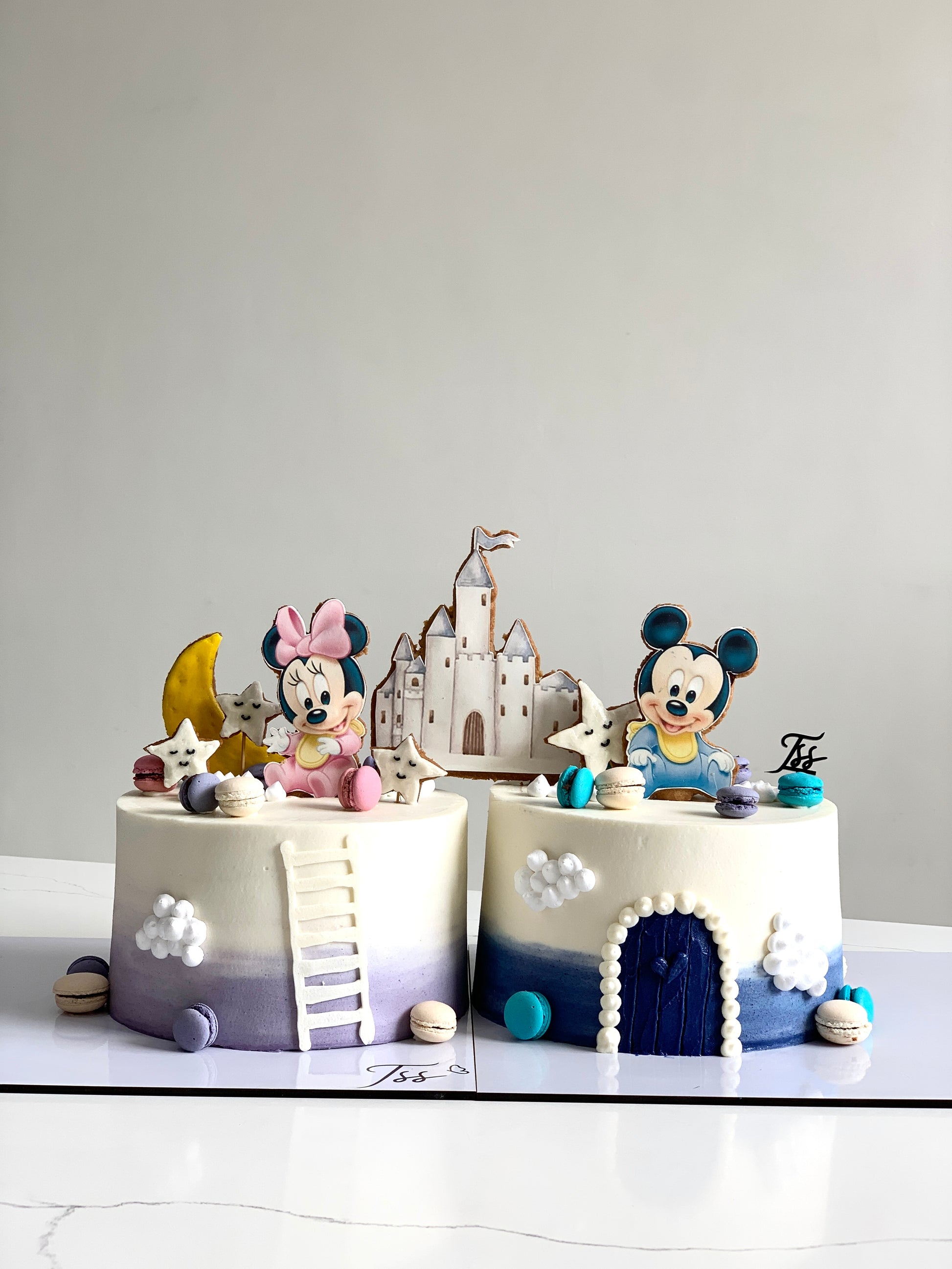 Decorative edible paper cake topper for baby girl celebration by The Sinful Spoon, featuring pastel colors and baby-themed design.