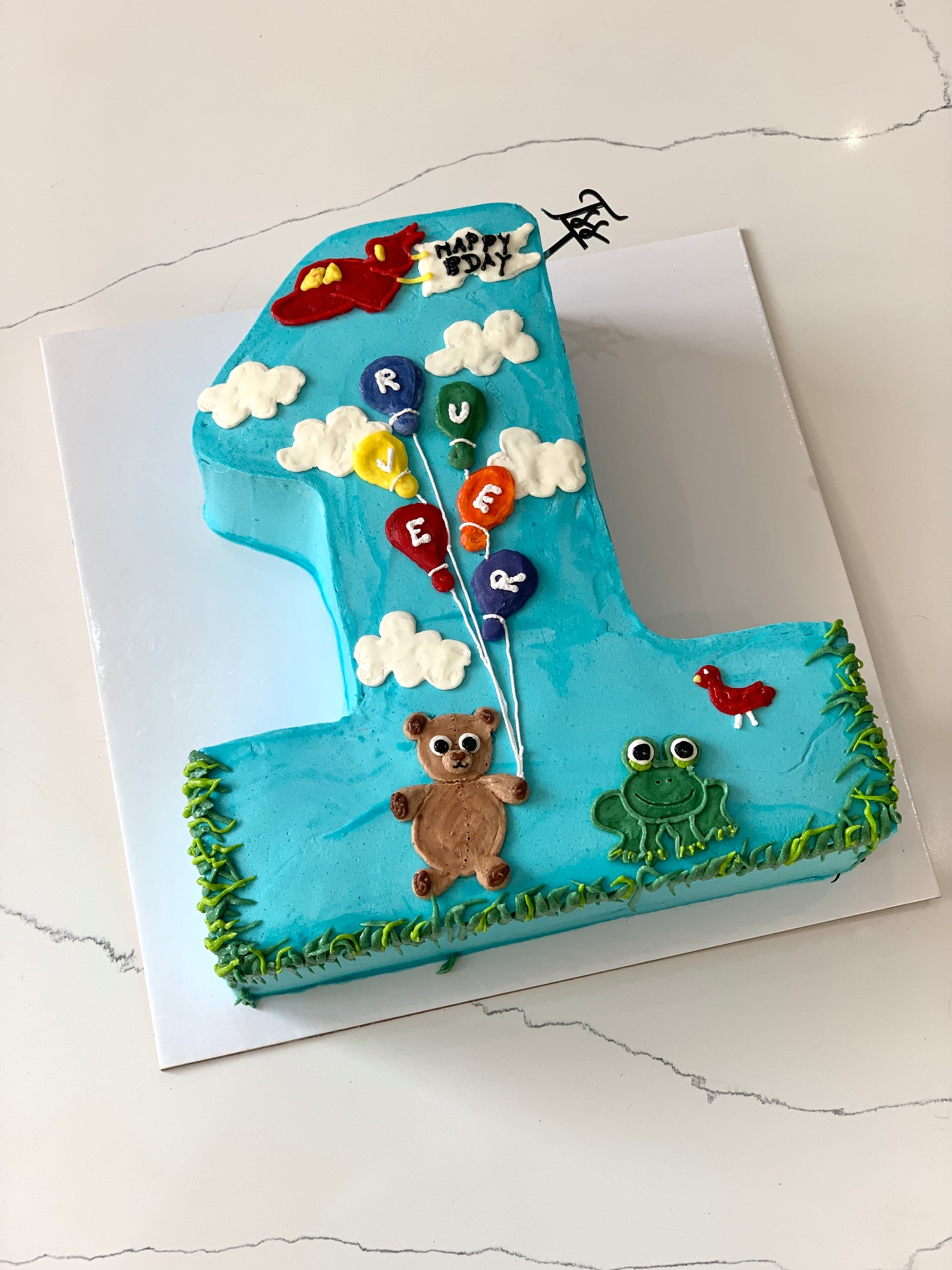 Colorful shape cakes from The Sinful Spoon, featuring various fun and vibrant dessert shapes on a white background.